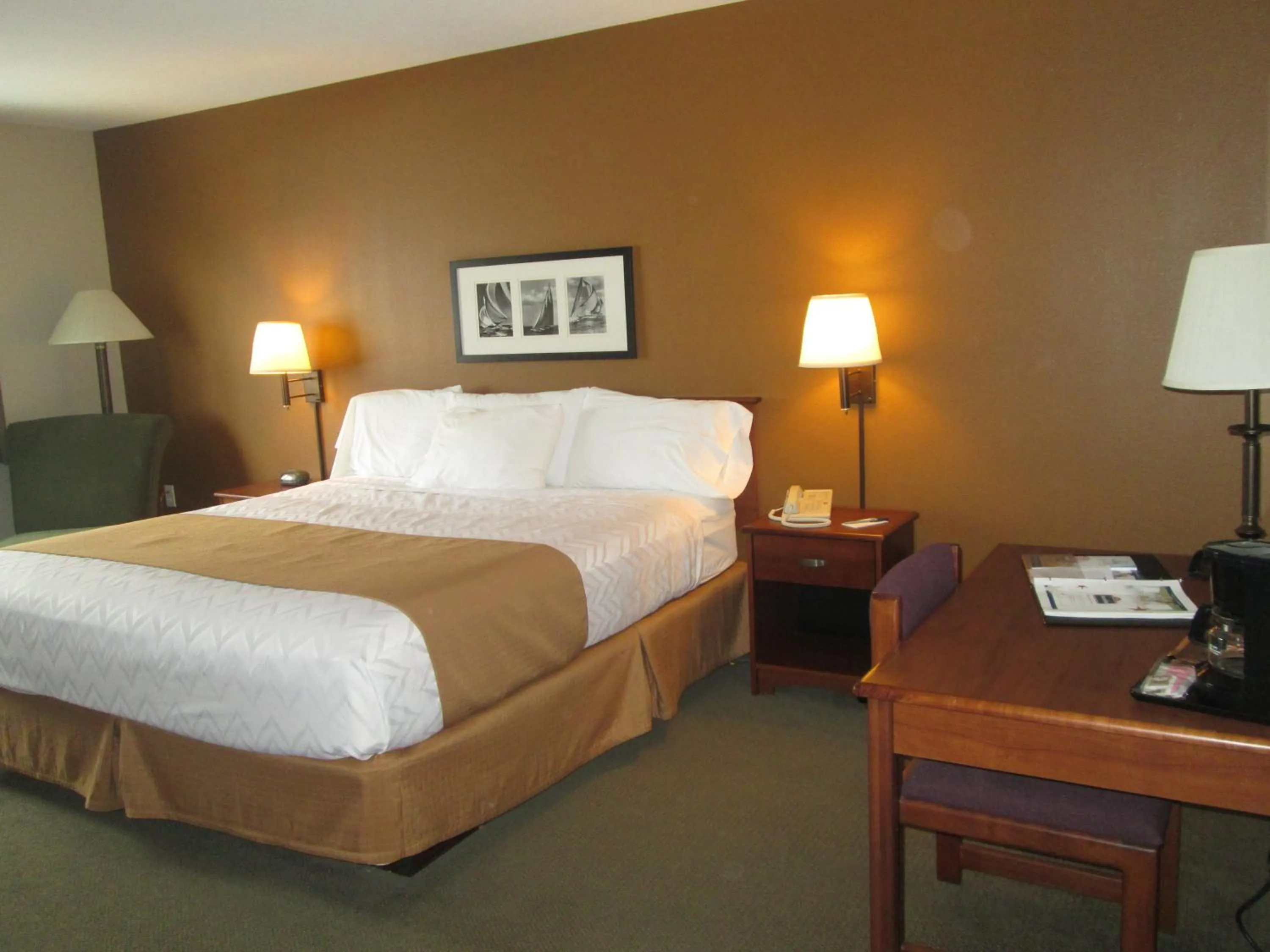 Bed in AmericInn by Wyndham Charlevoix