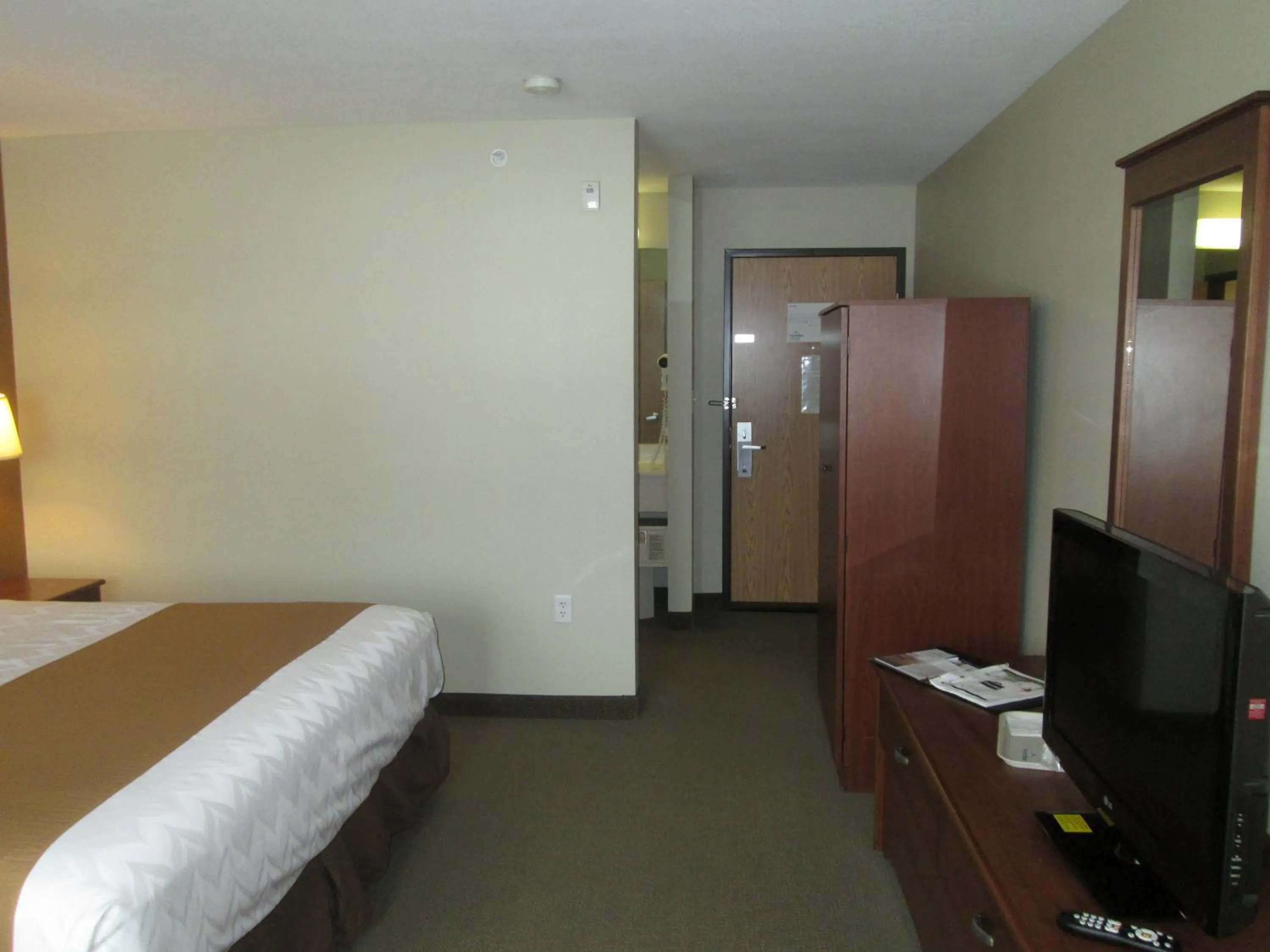 Bed in AmericInn by Wyndham Charlevoix