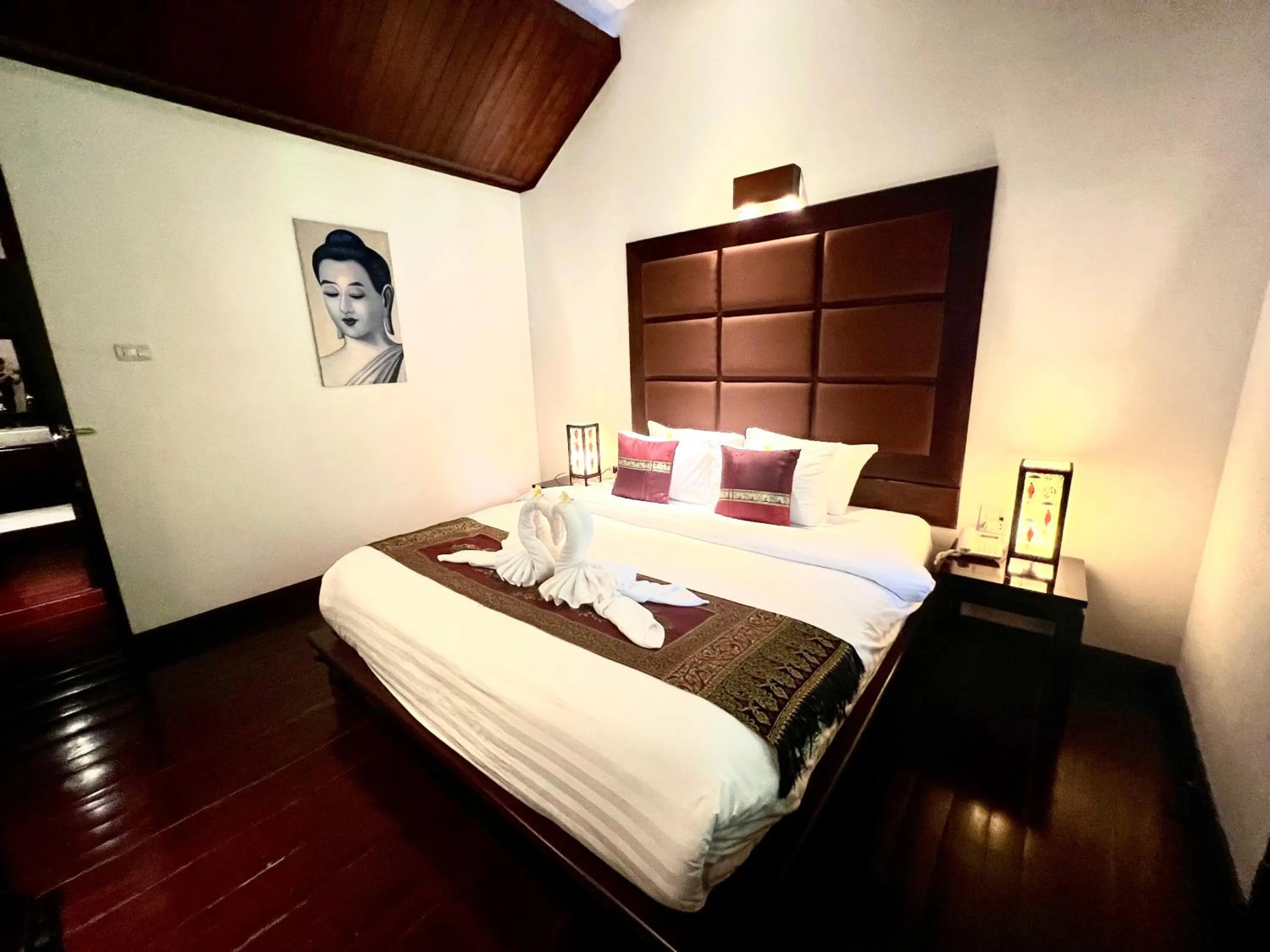 Bed in Meuangluang Hotel