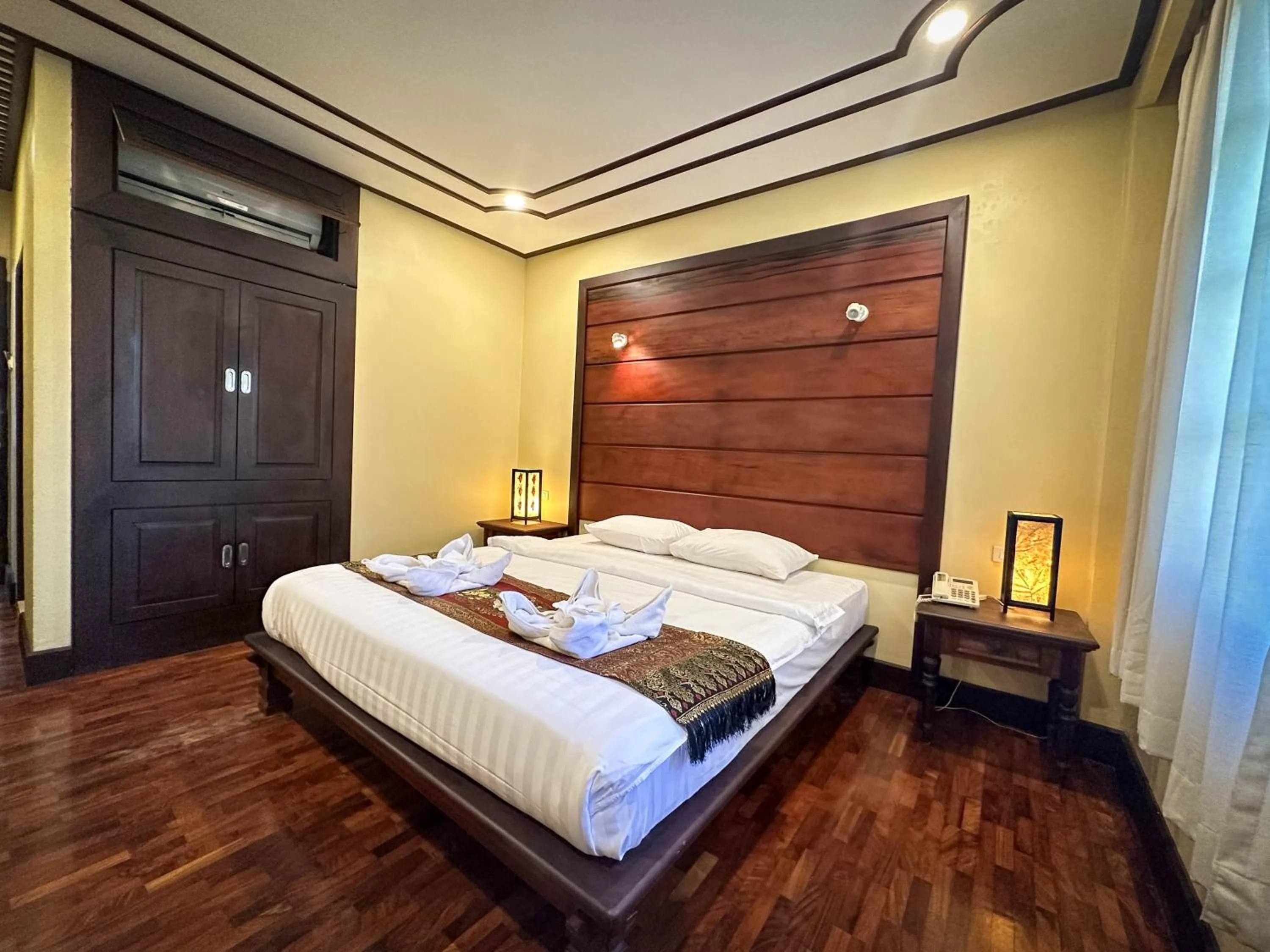 Bed in Meuangluang Hotel