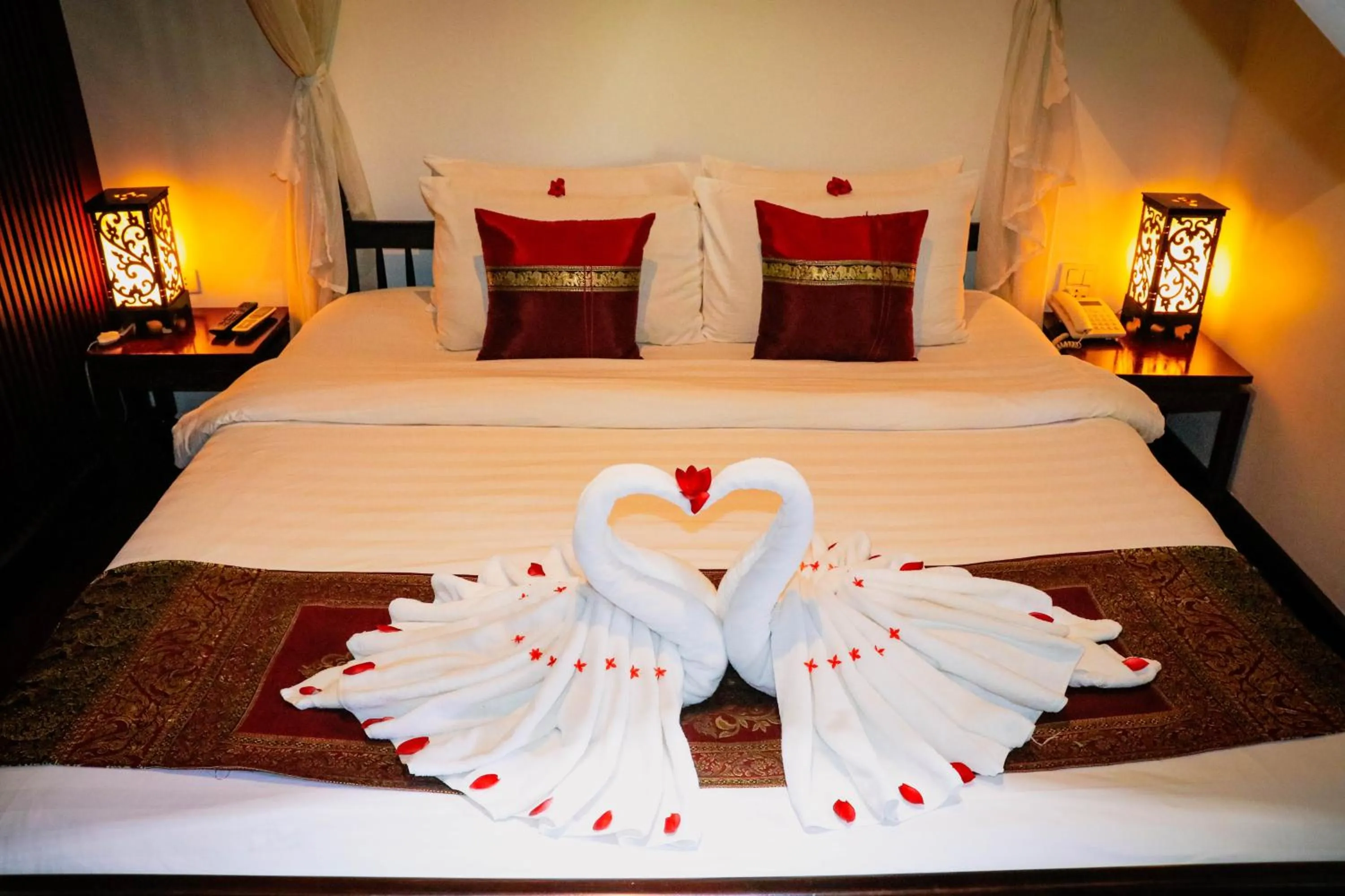 Bed in Meuangluang Hotel