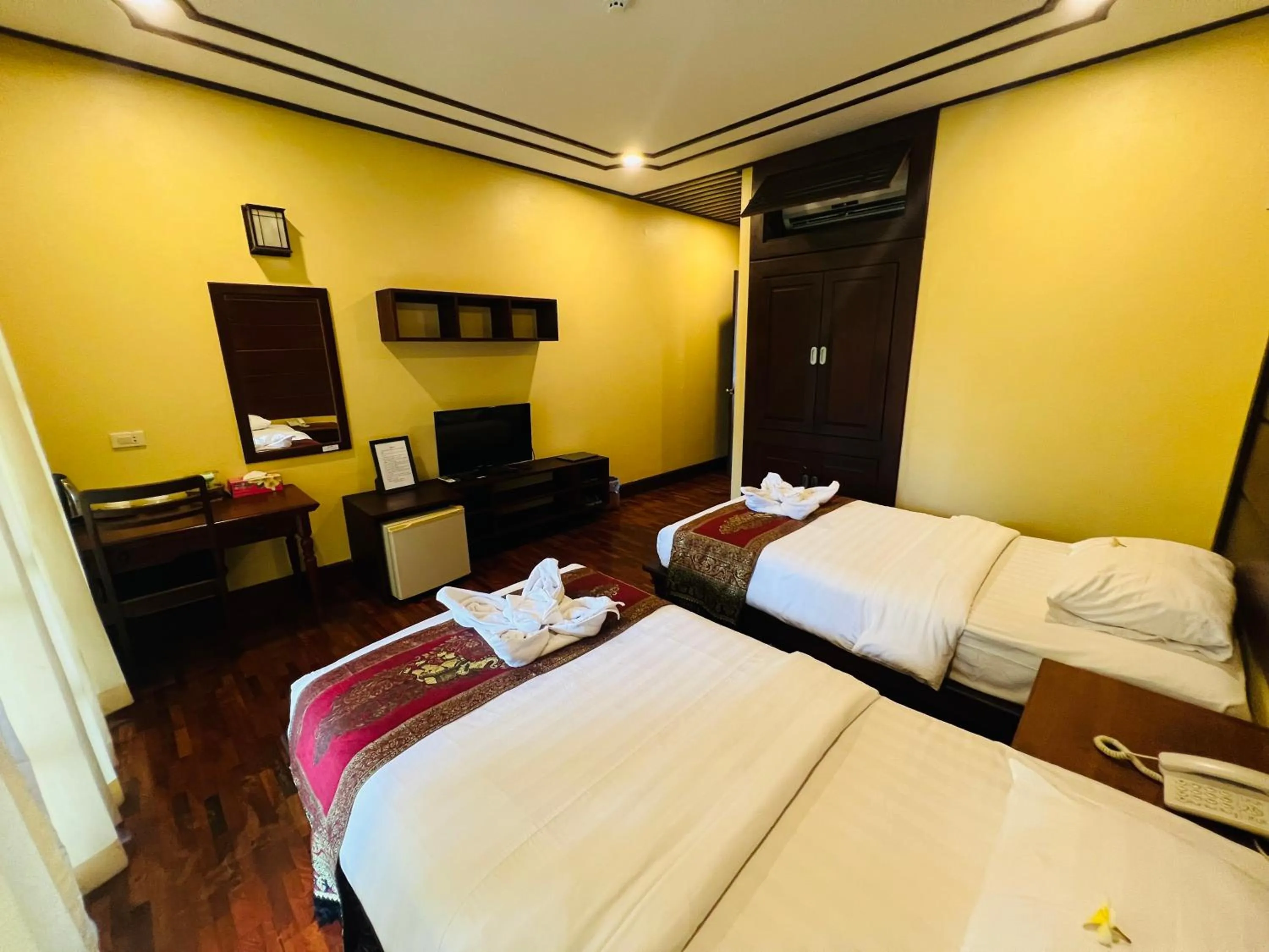 Bed in Meuangluang Hotel