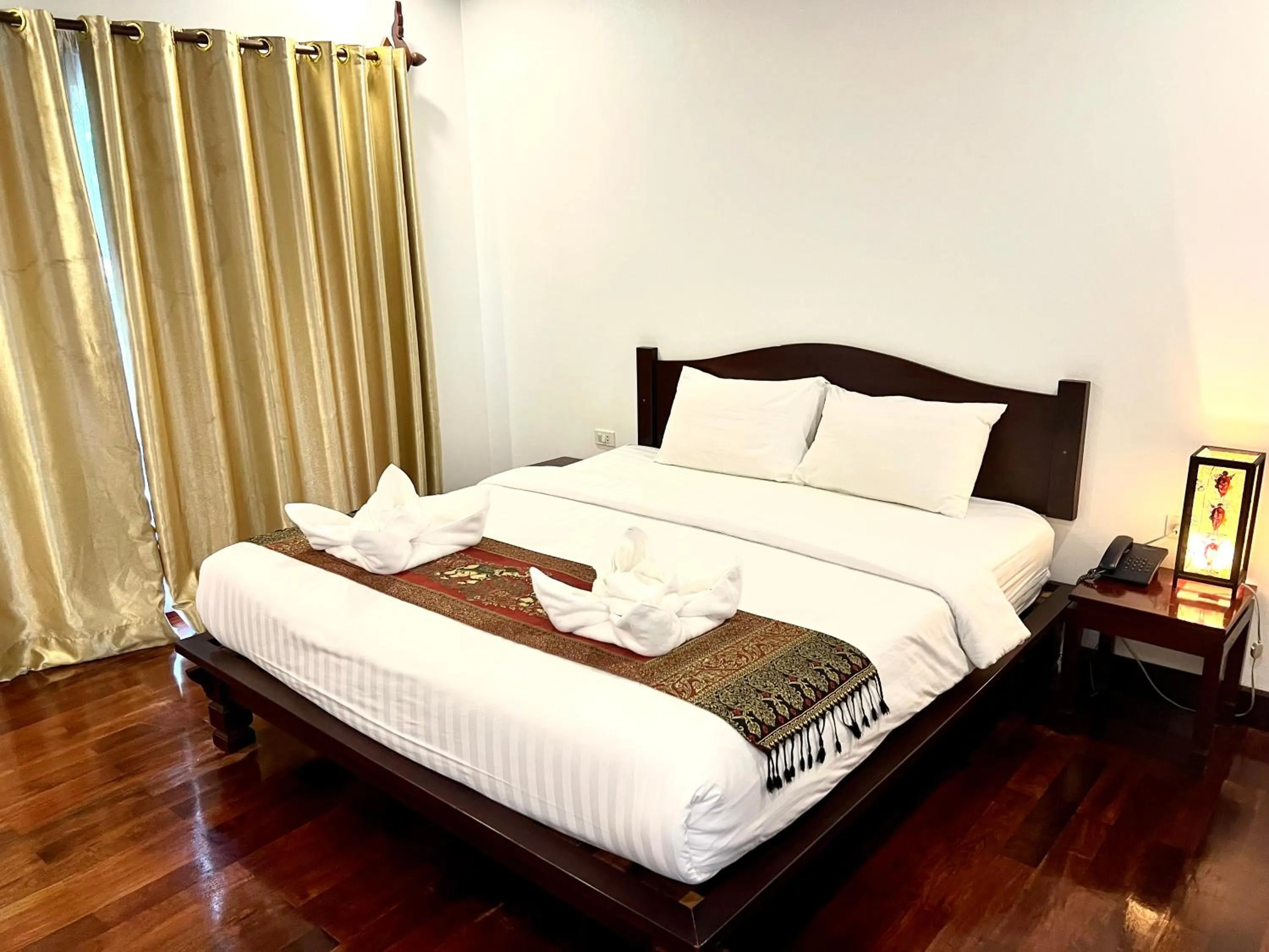 Bed in Meuangluang Hotel