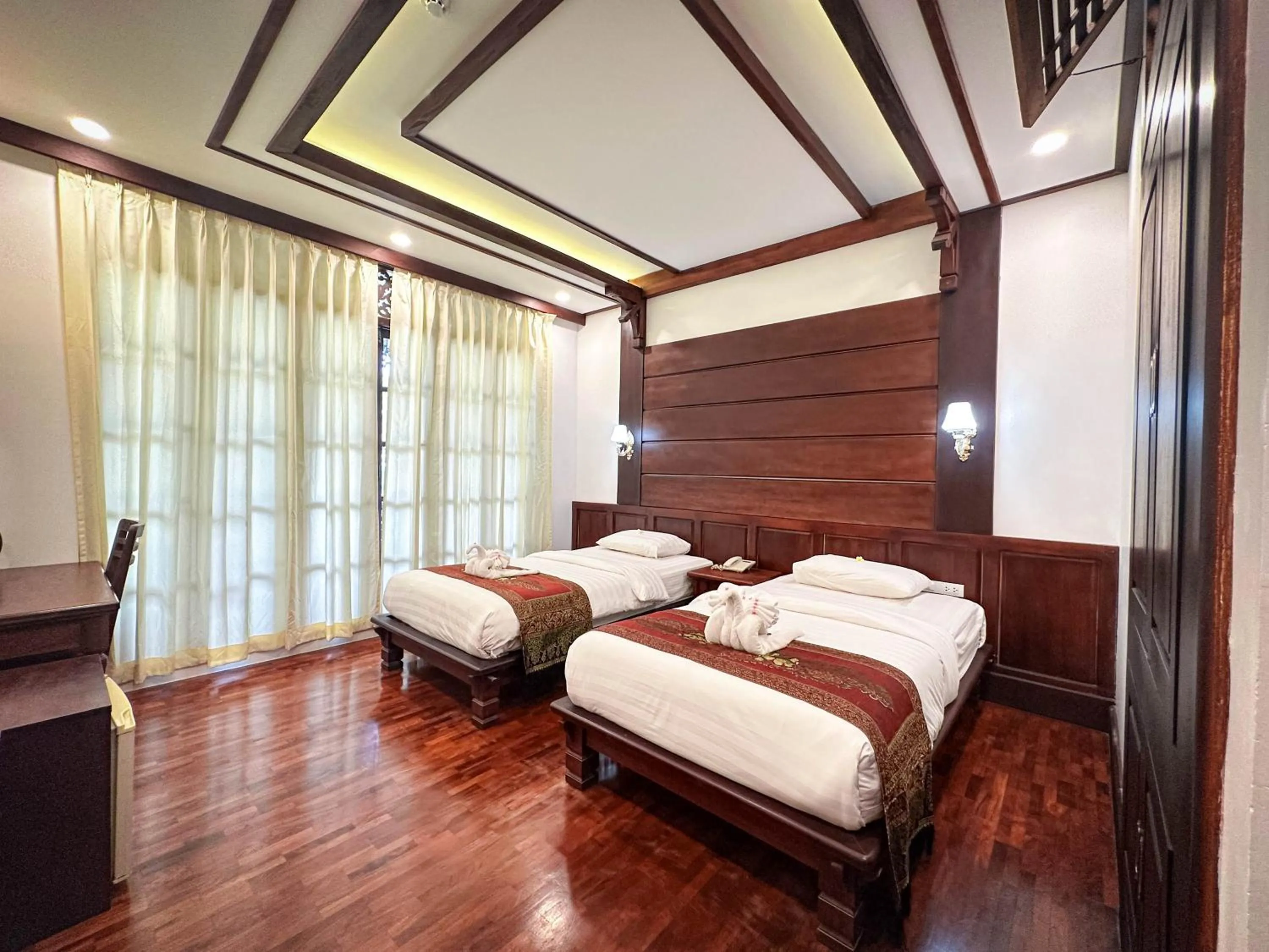 Bed in Meuangluang Hotel