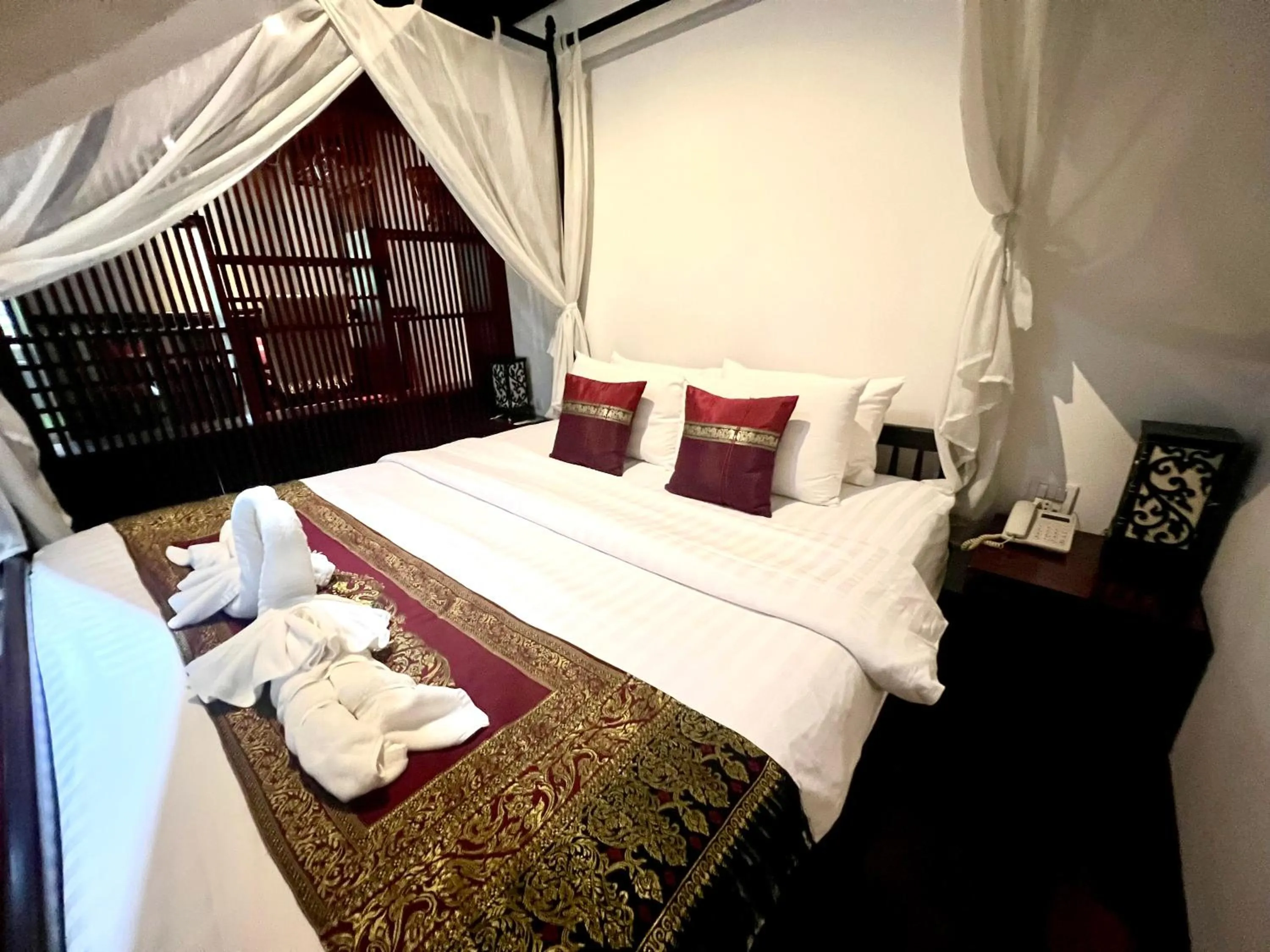 Bedroom in Meuangluang Hotel