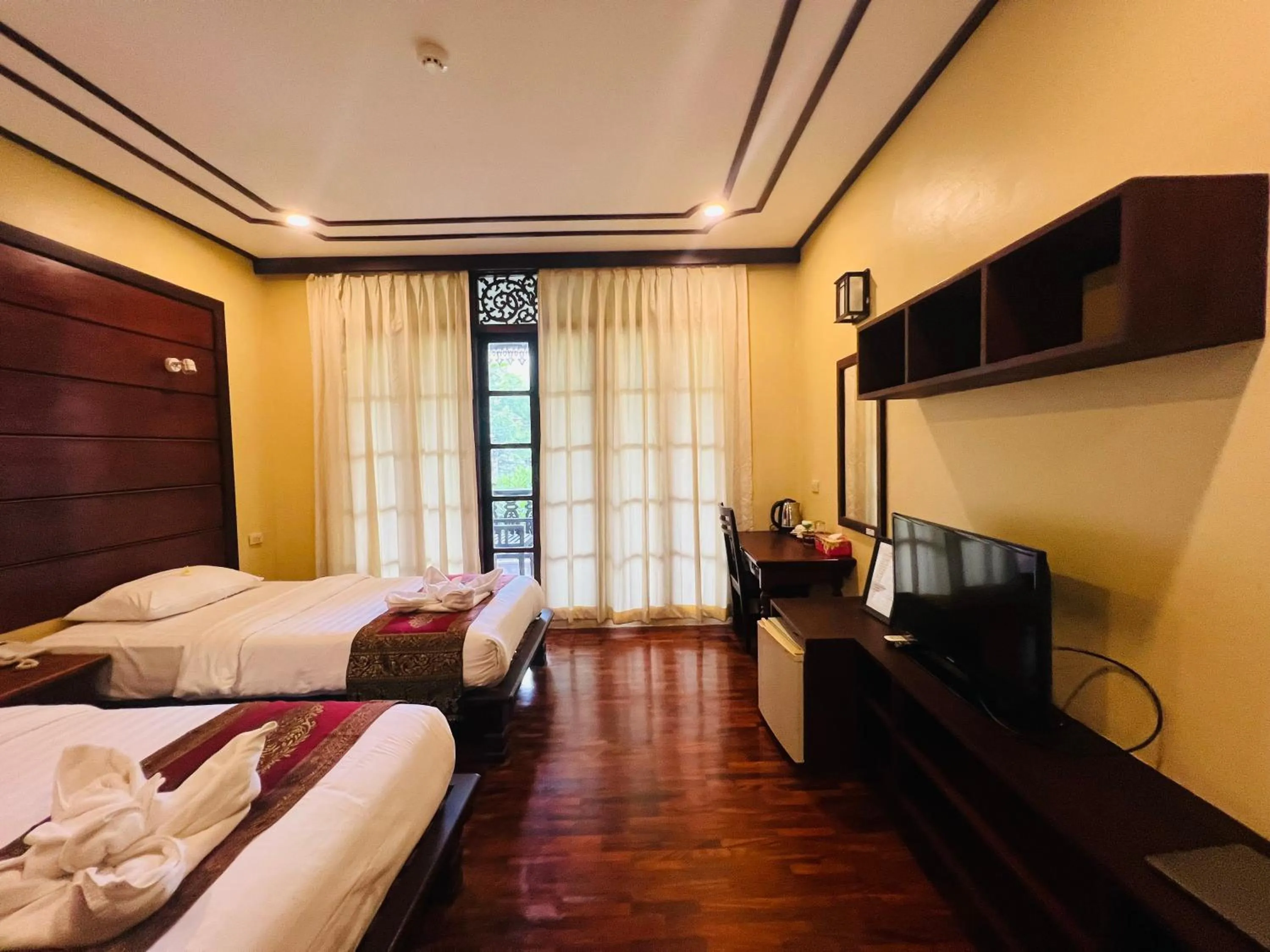 Bed in Meuangluang Hotel