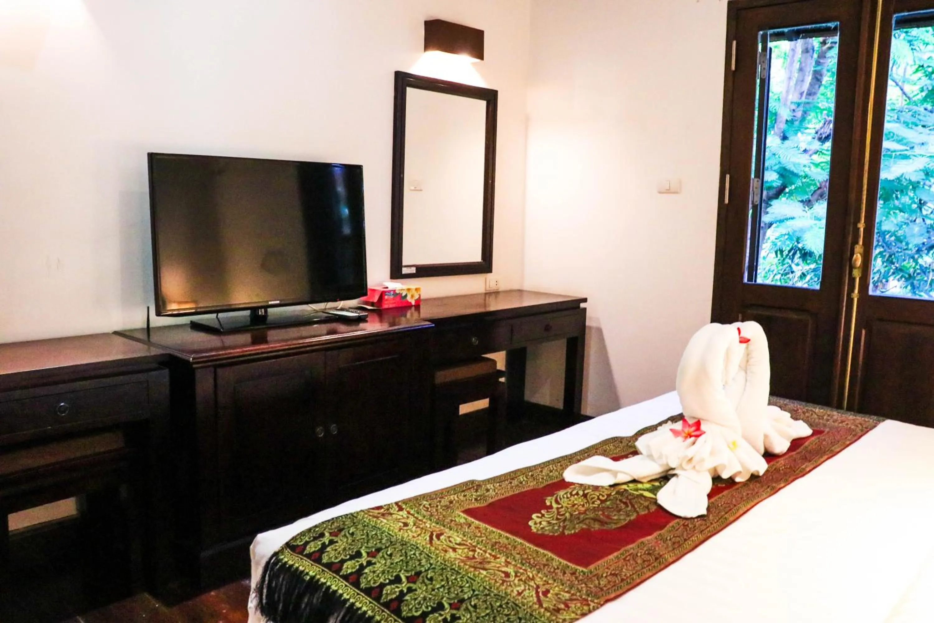 Bed in Meuangluang Hotel