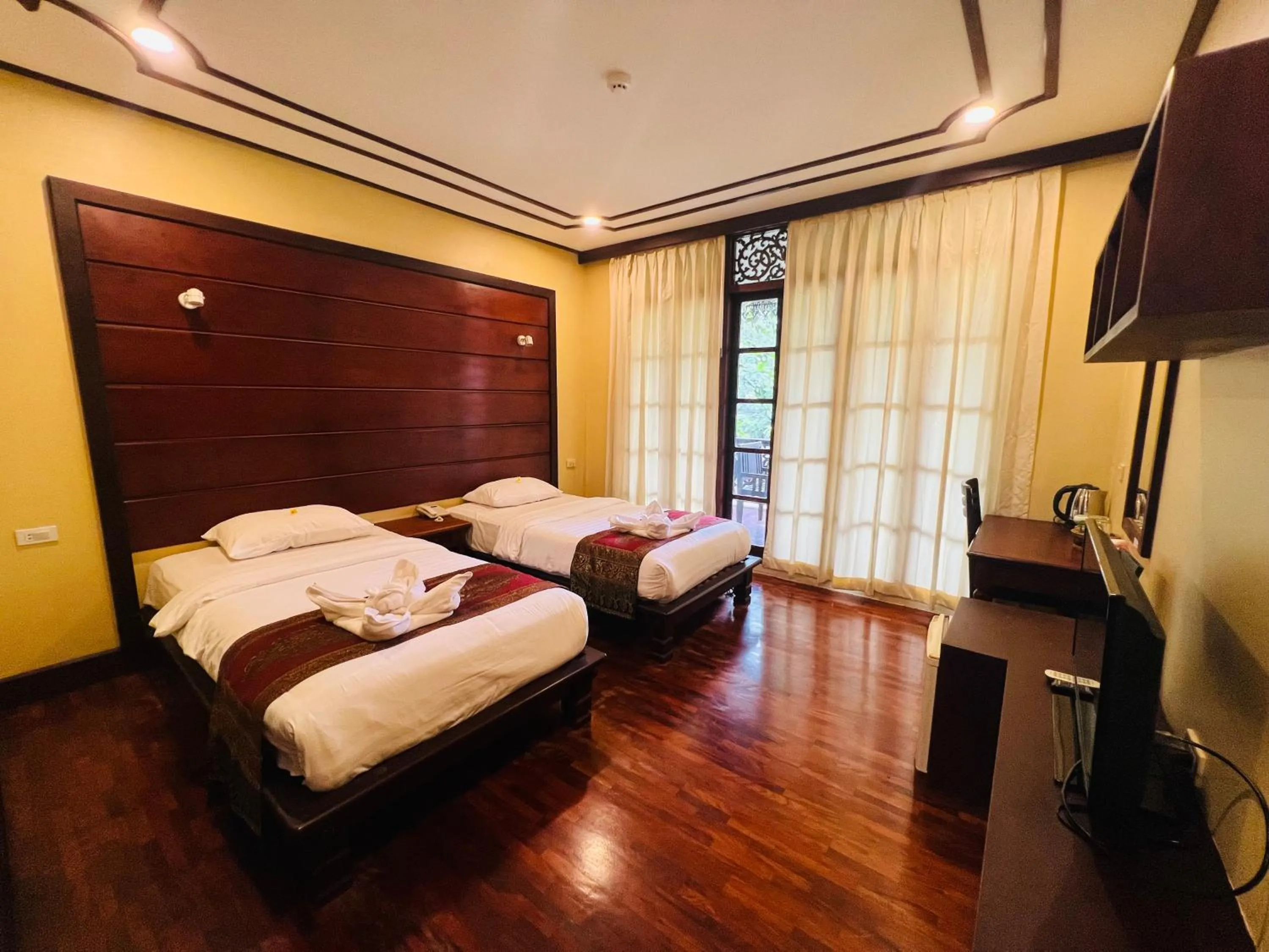 Bed in Meuangluang Hotel