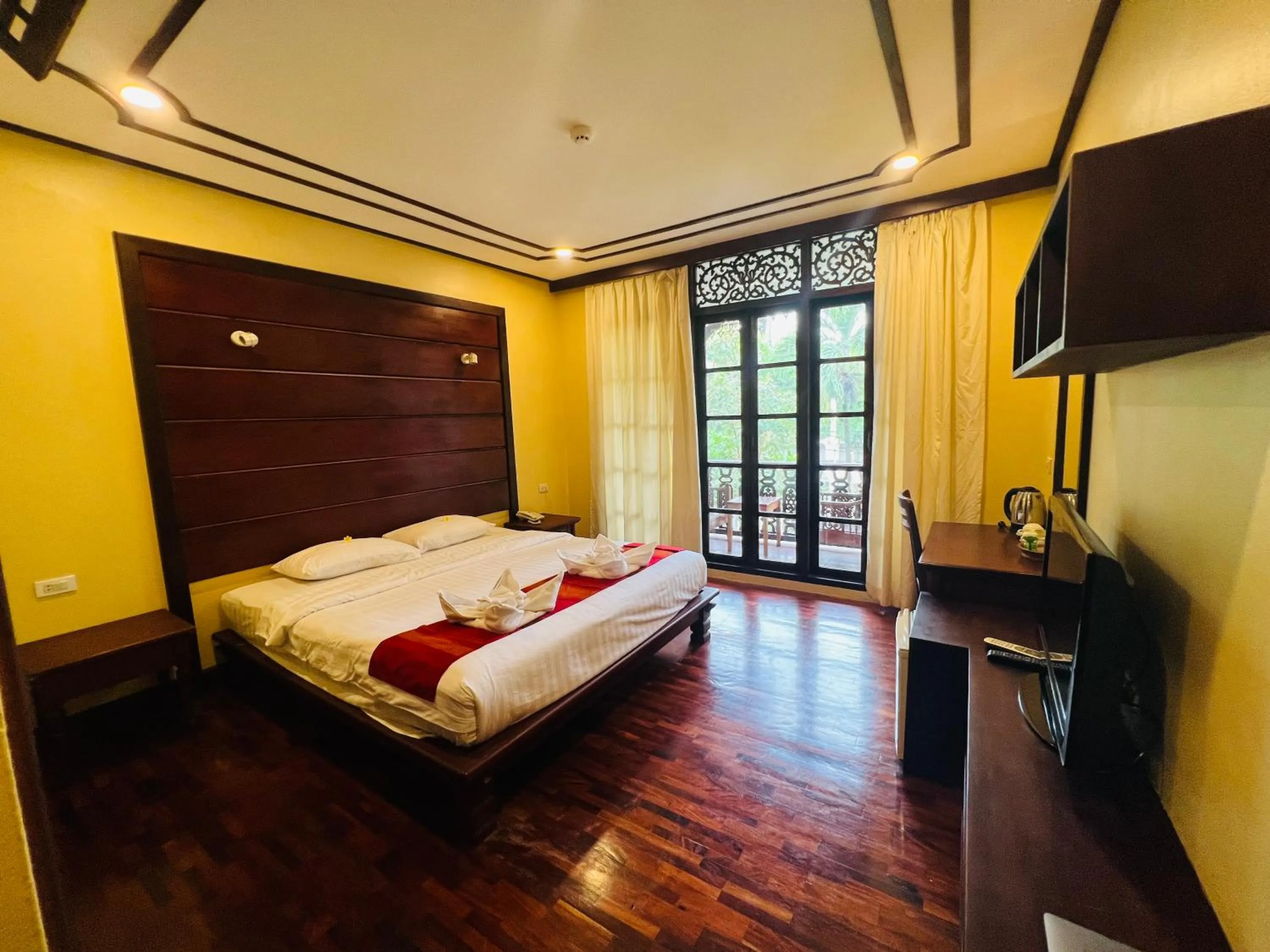 Bed in Meuangluang Hotel