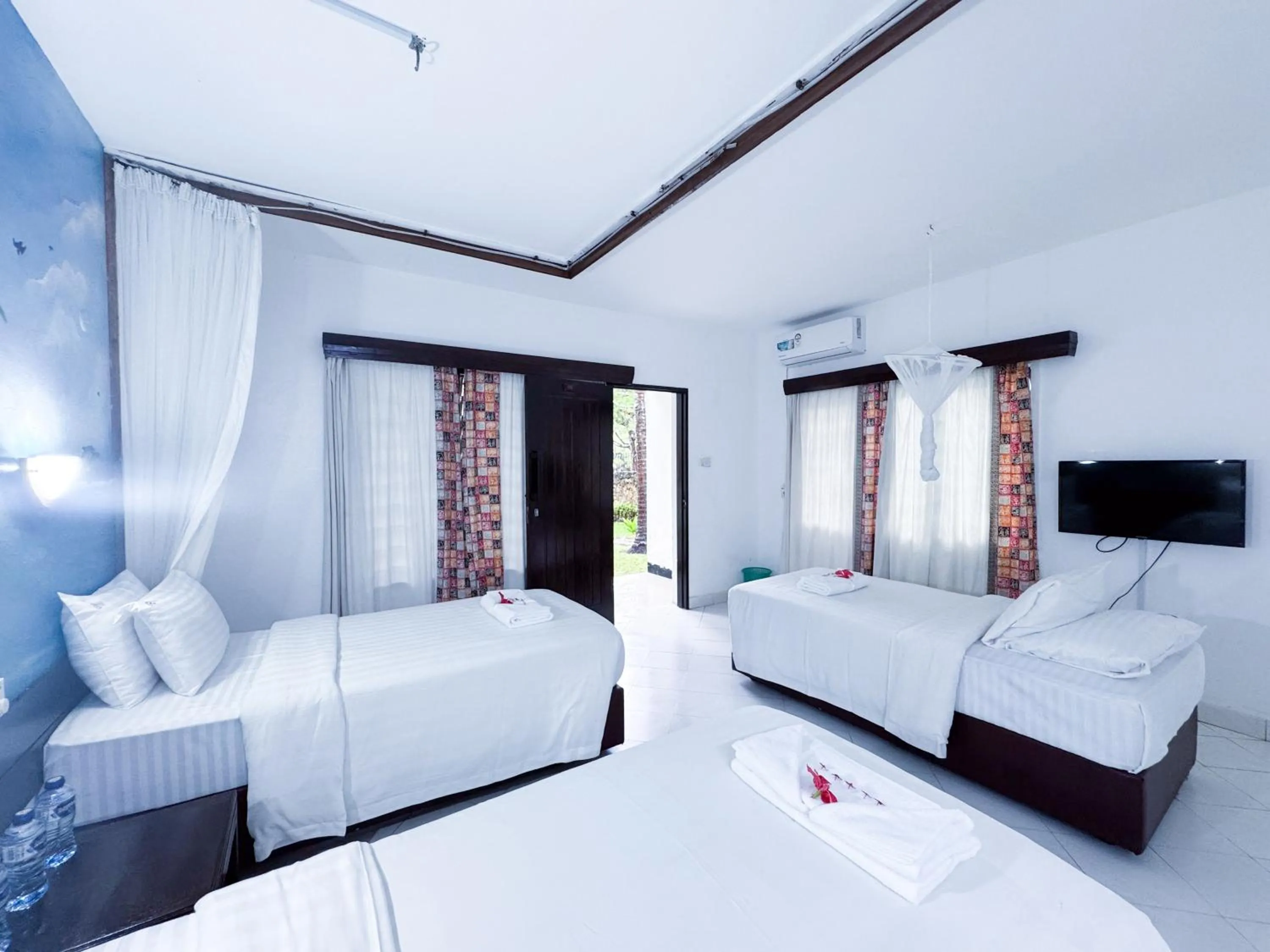 Bed in Milele Beach Hotel