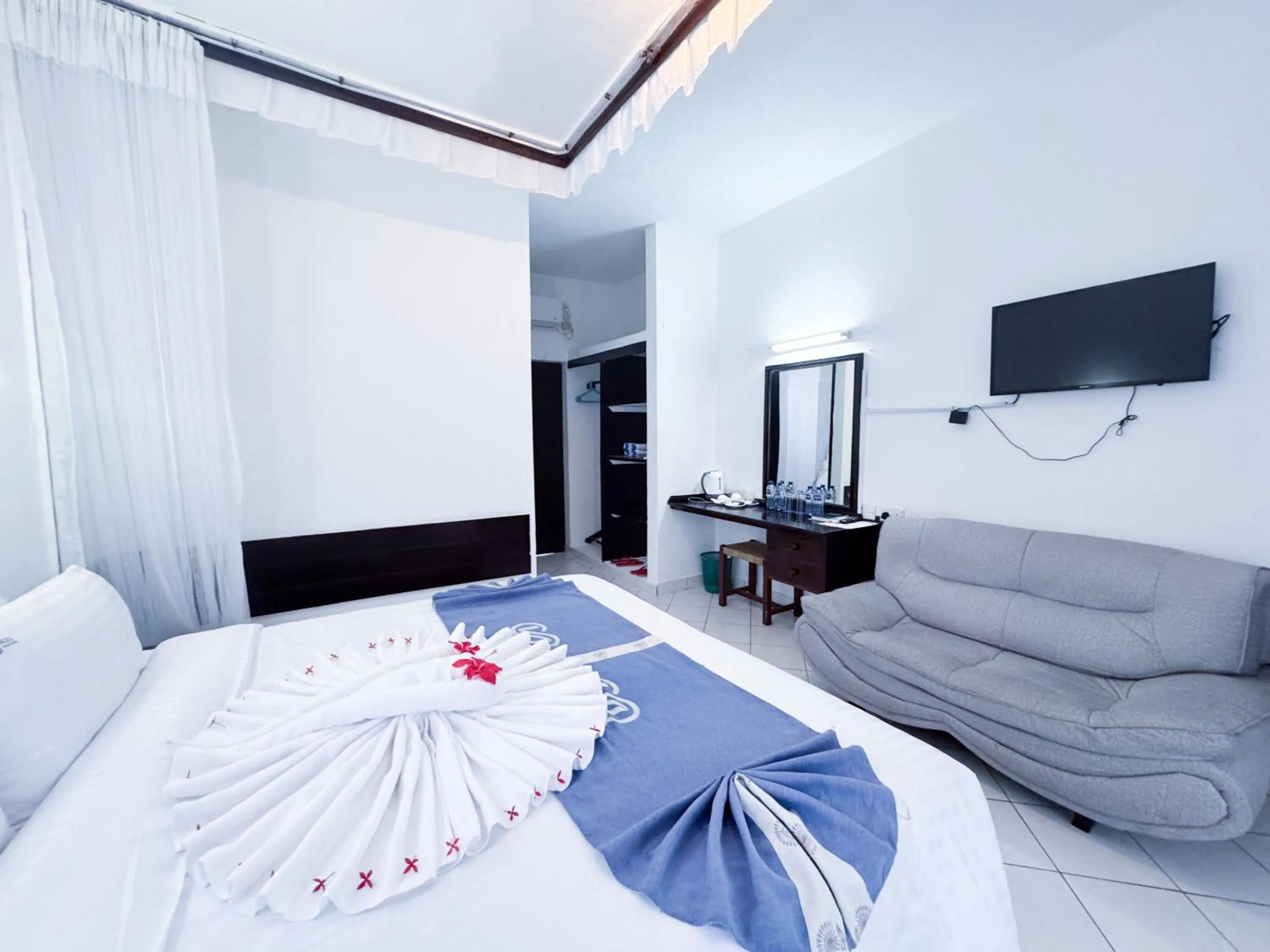 TV and multimedia, Bed in Milele Beach Hotel