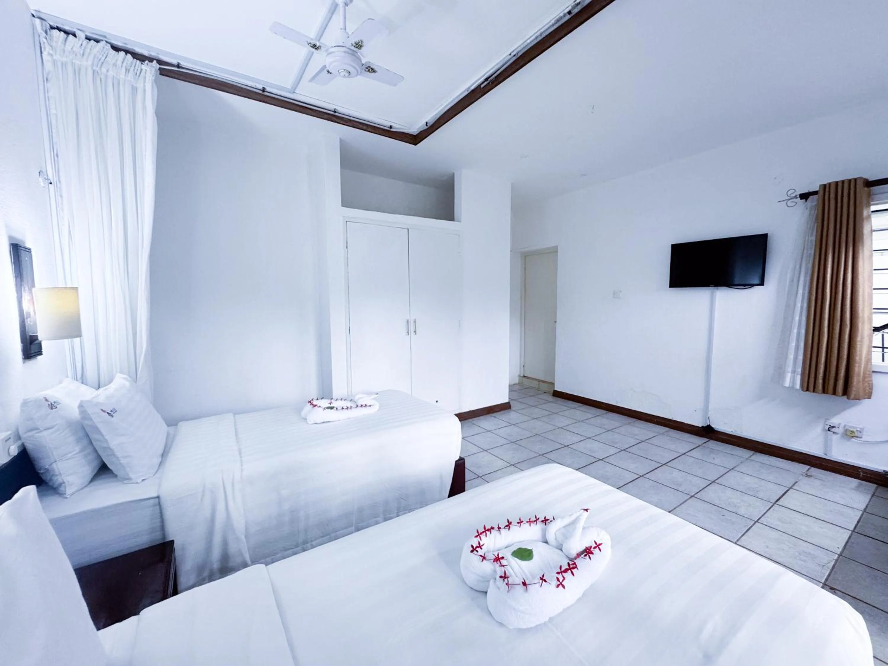 Bed in Milele Beach Hotel