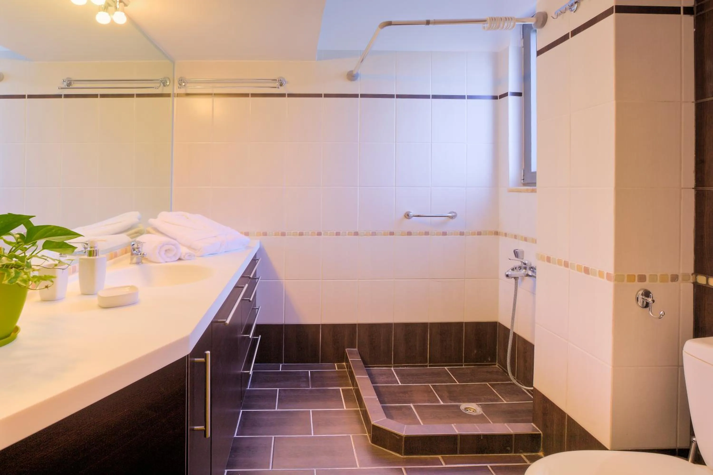 Bathroom in Marini Luxury Apartments and Suites