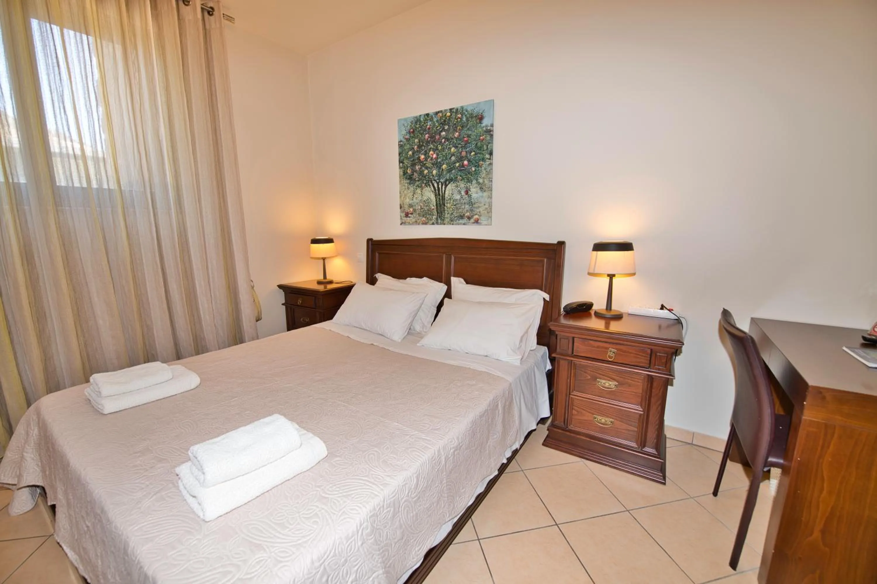 Bed in Marini Luxury Apartments and Suites