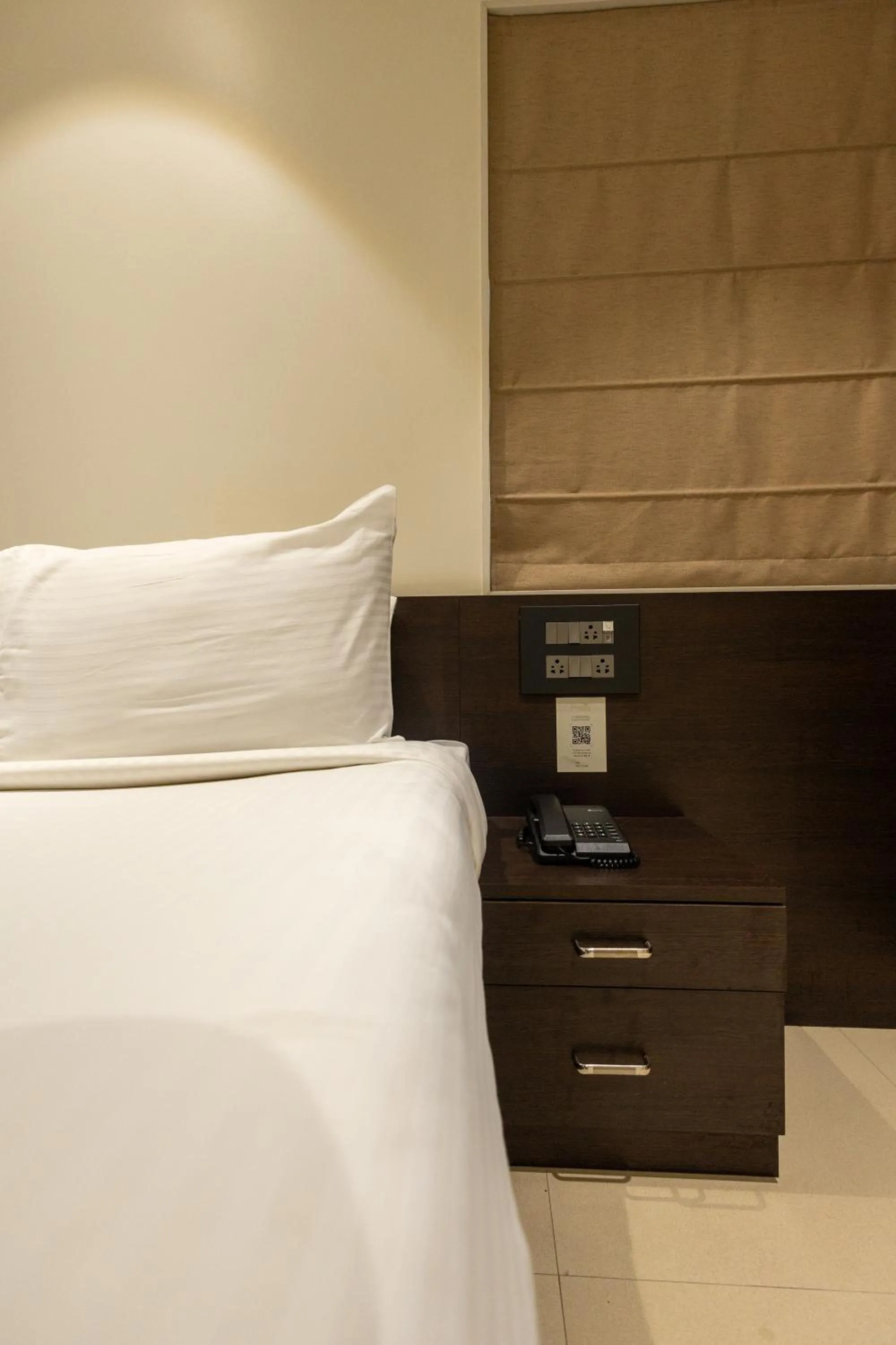 Bed in Freesia Residency by Express Inn
