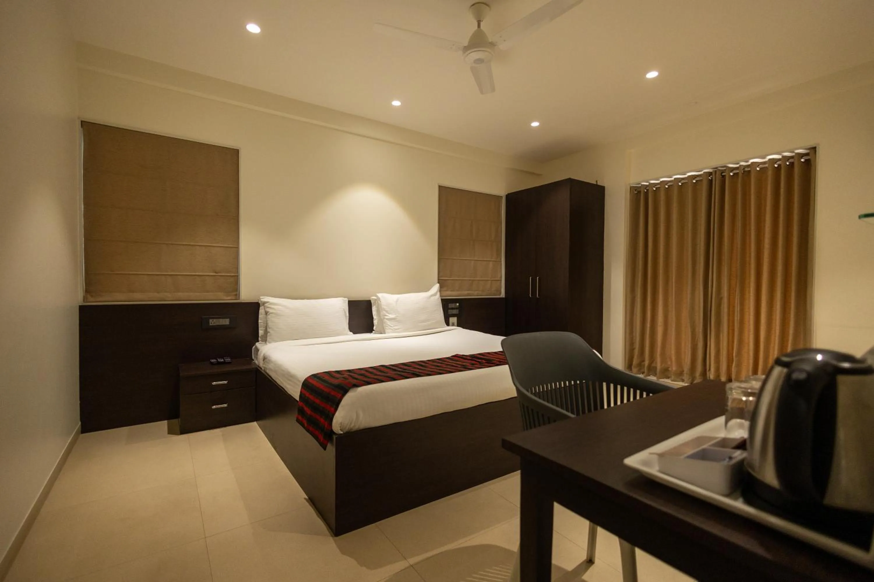 Bed in Freesia Residency by Express Inn