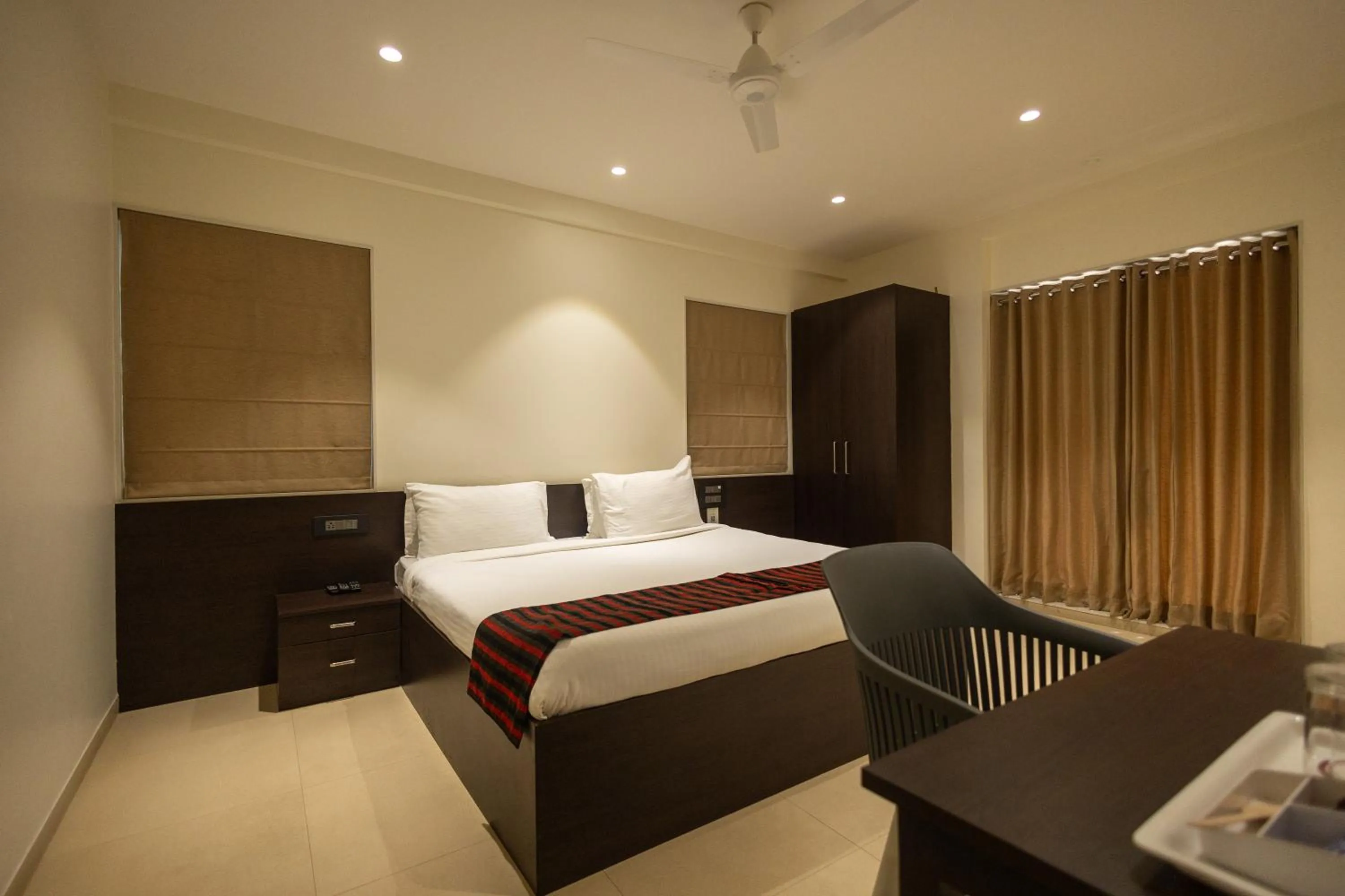 Bed in Freesia Residency by Express Inn