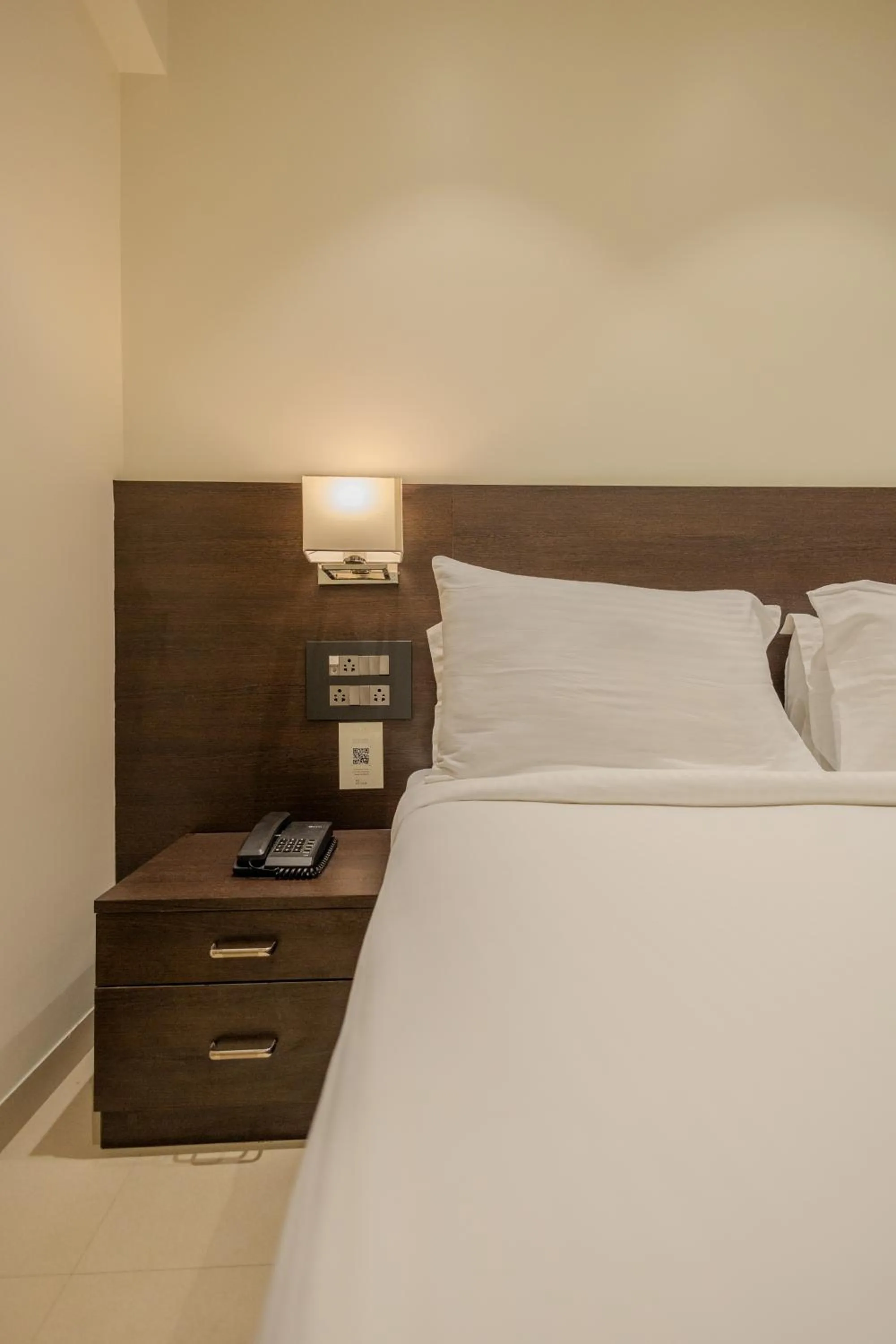 Bed in Freesia Residency by Express Inn