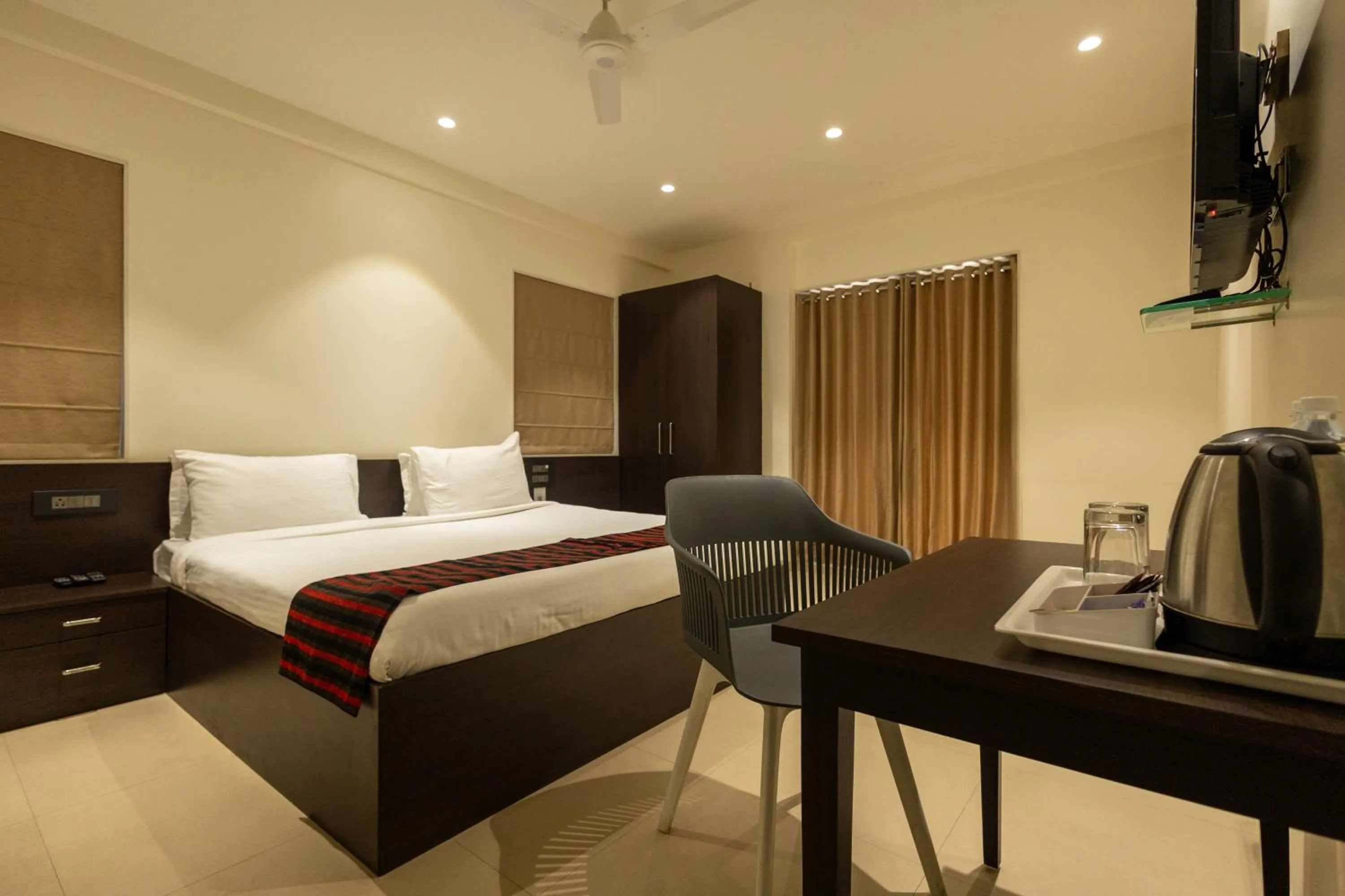 Bed in Freesia Residency by Express Inn