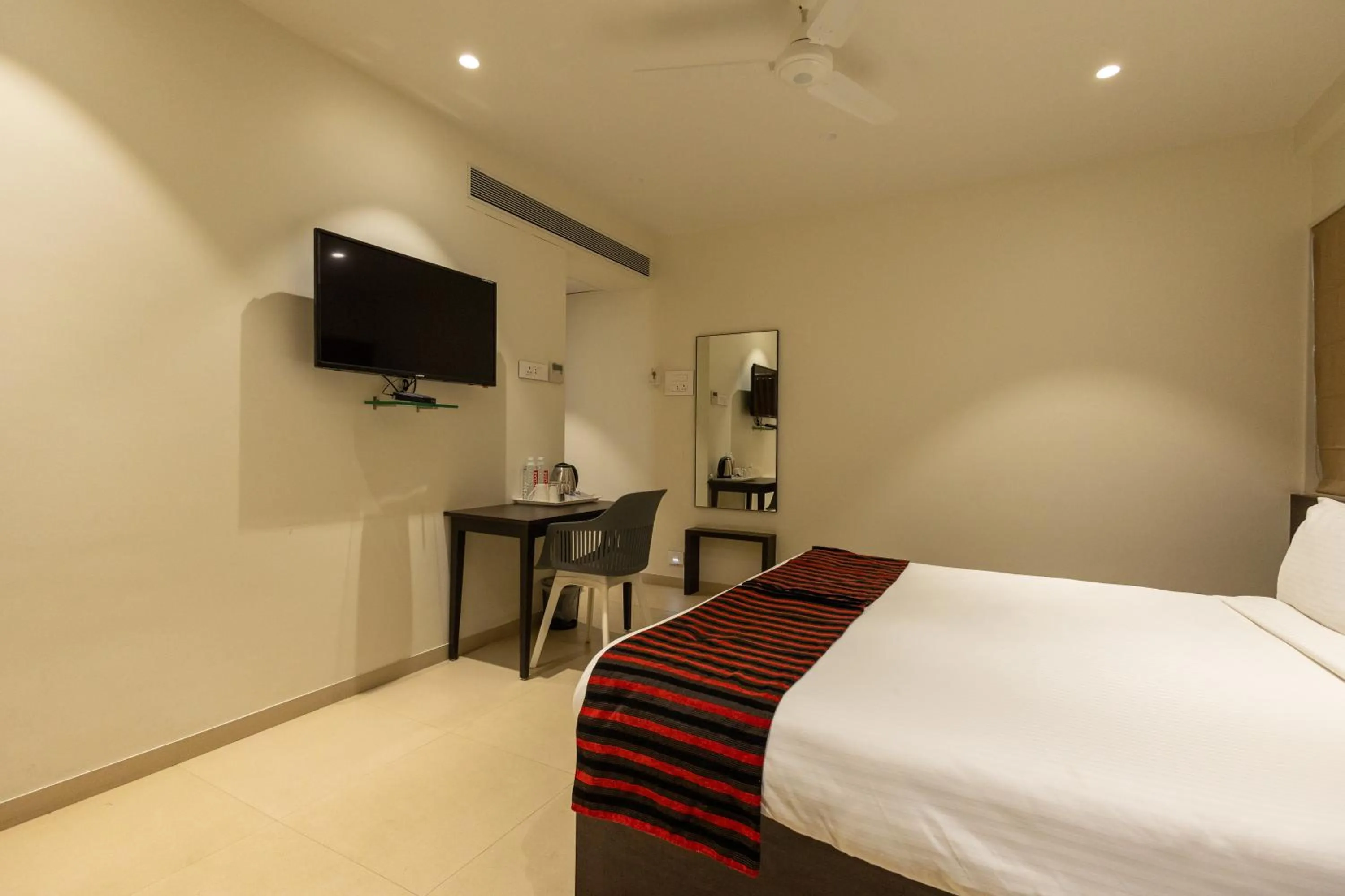 Communal lounge/ TV room, Bed in Freesia Residency by Express Inn