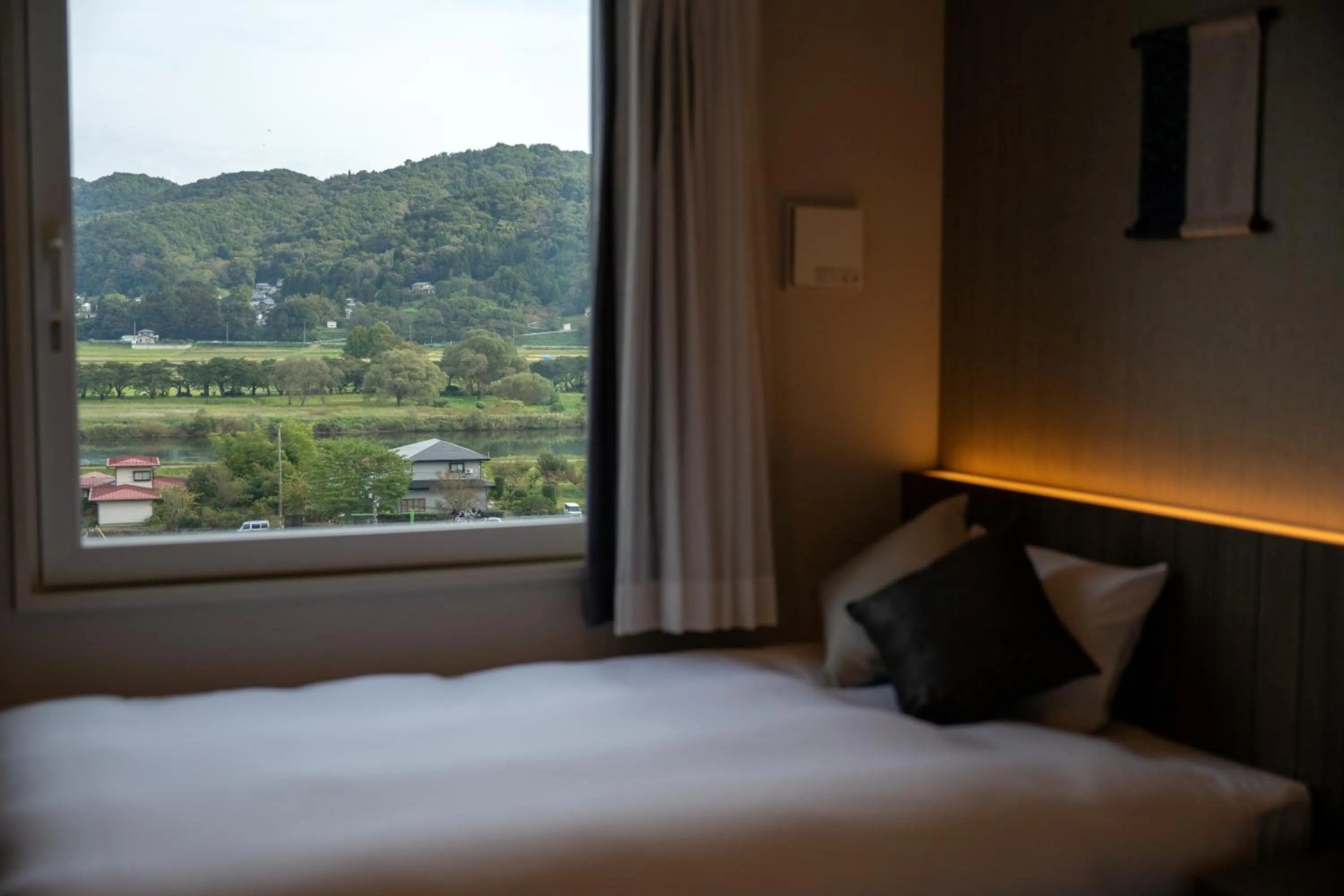 Bed in SAKURA PORT HOTEL