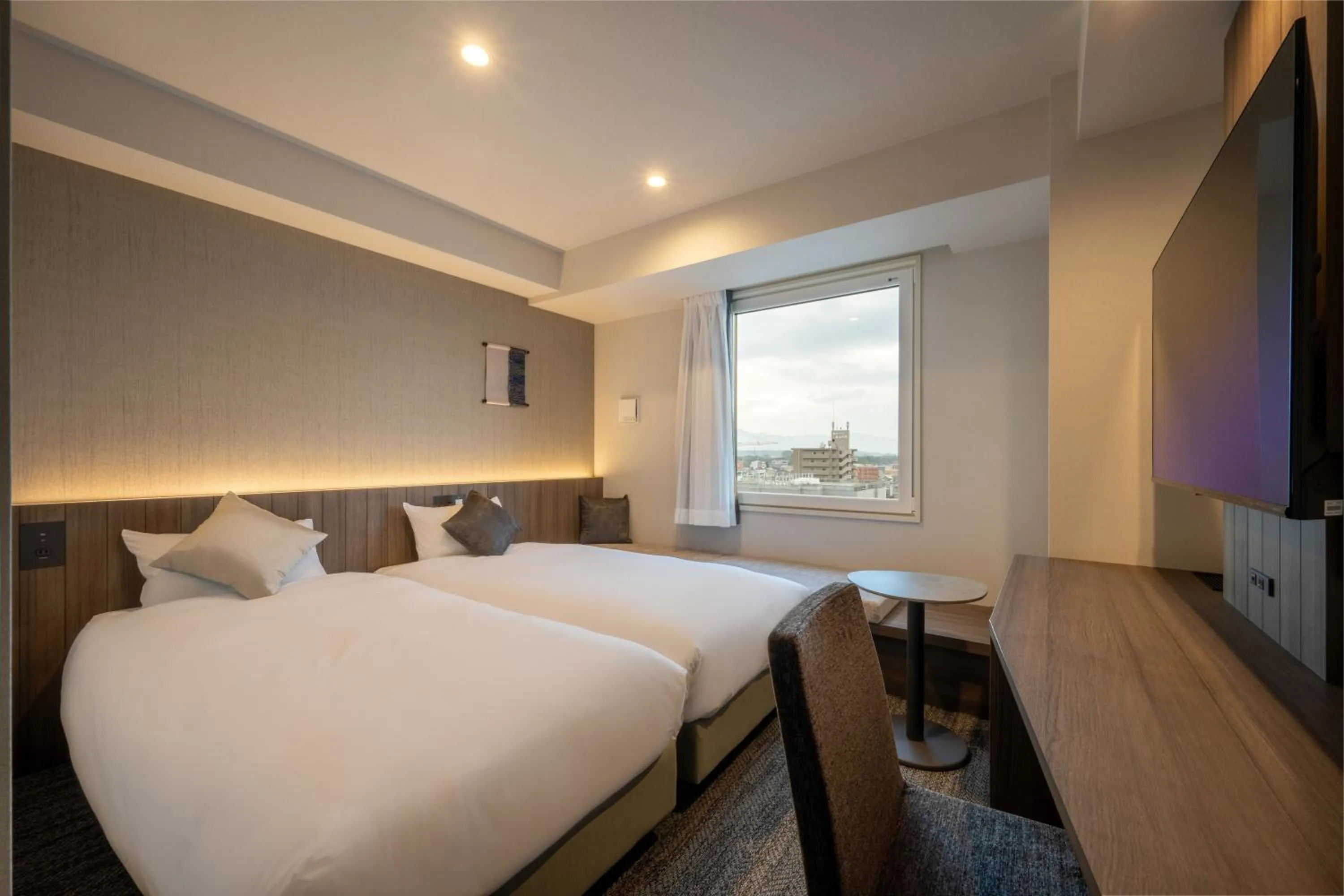 Bed in SAKURA PORT HOTEL