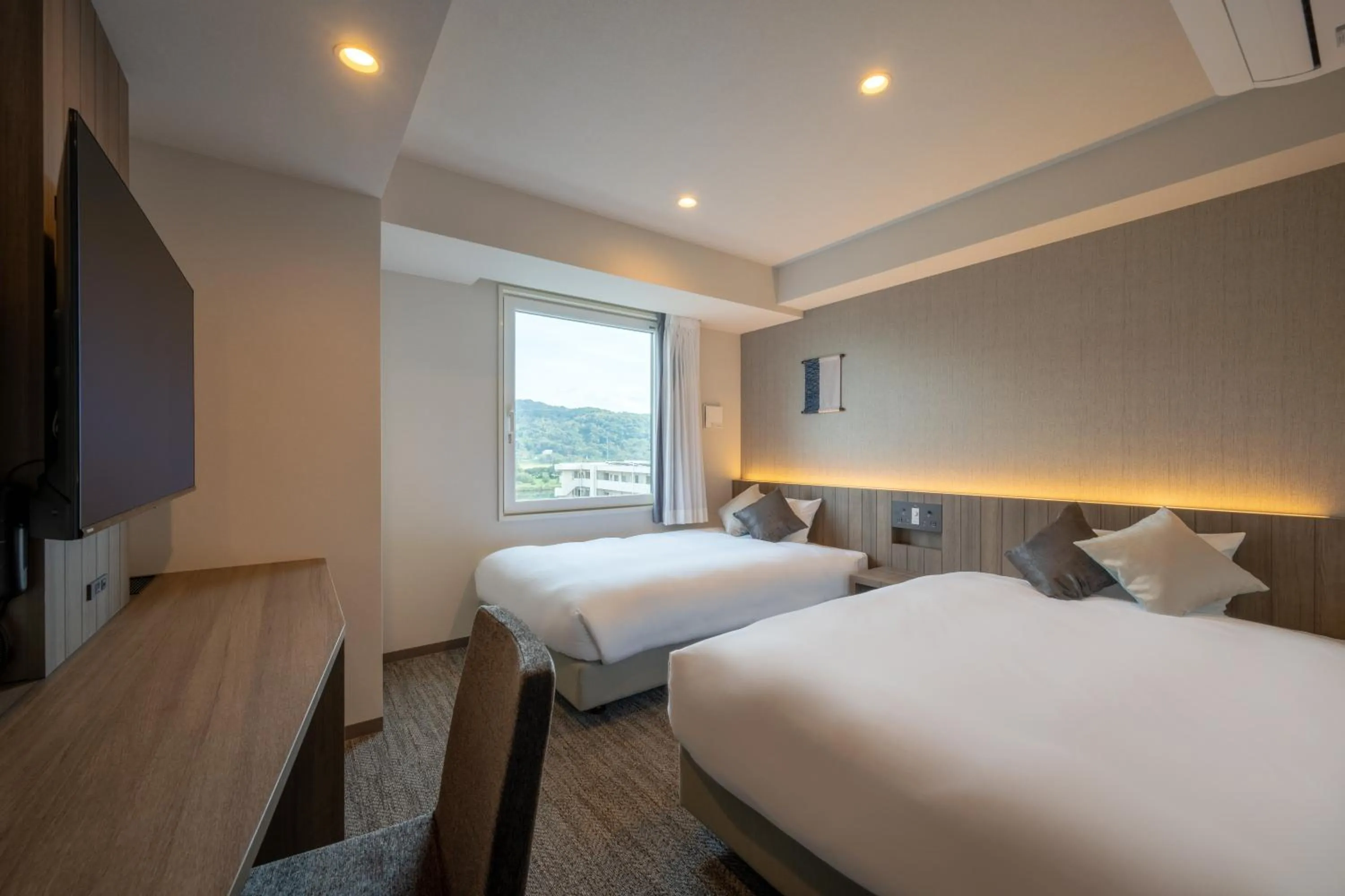 Bed in SAKURA PORT HOTEL