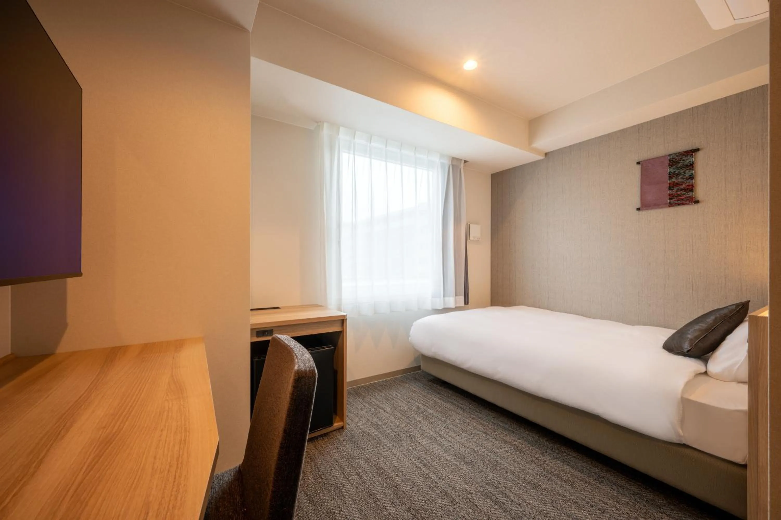 Bed in SAKURA PORT HOTEL