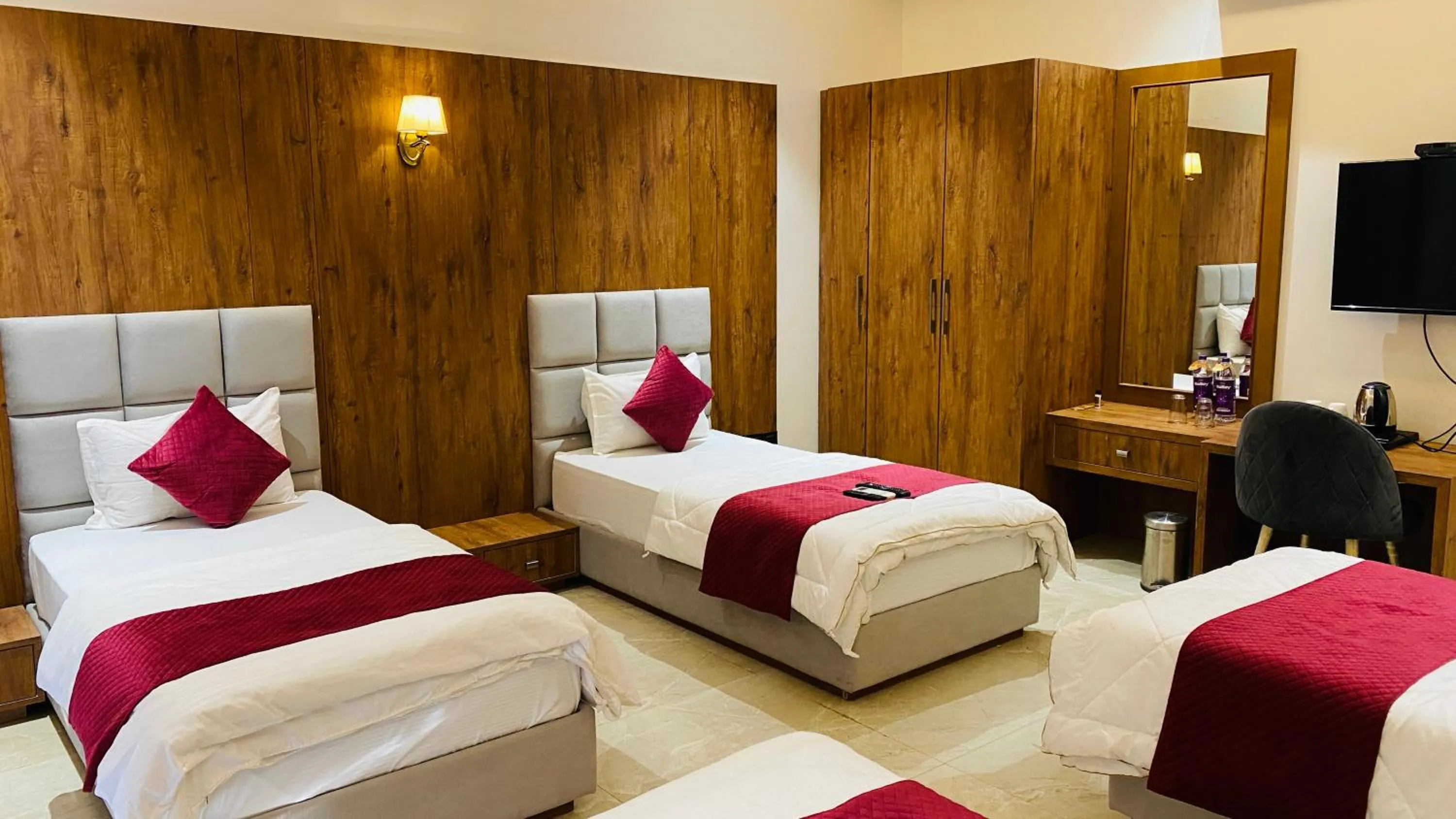 Bed in Gaurison Hotel and Resorts