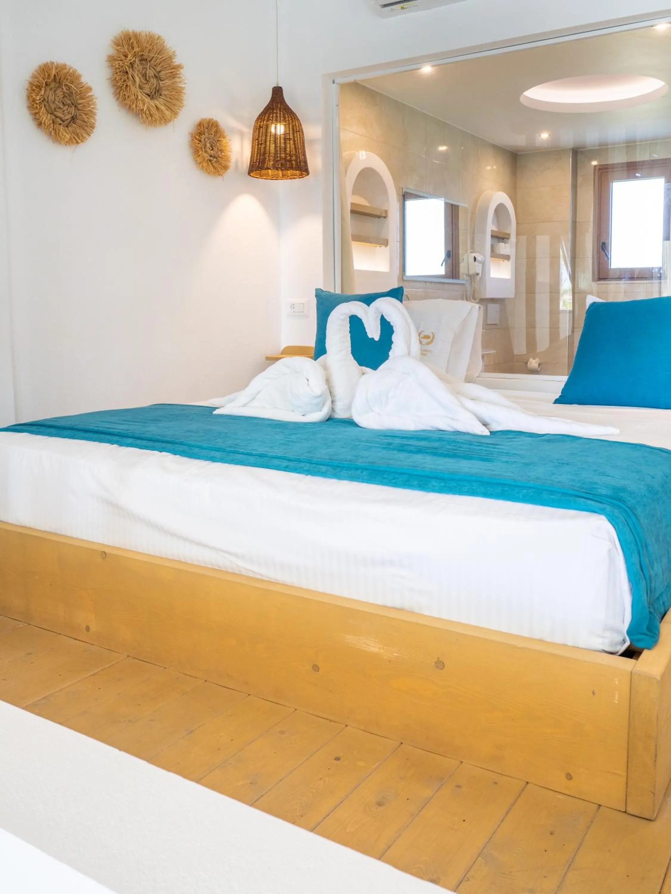 Bed in Alia Beachfront Suites and Spa