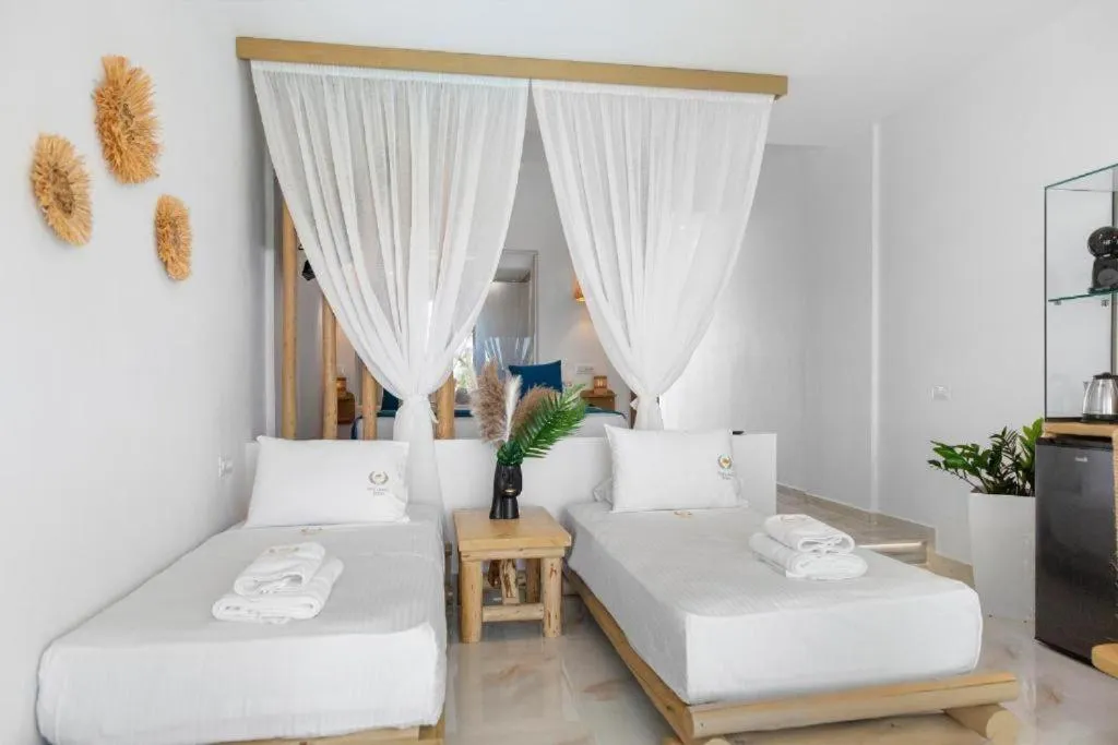Bed in Alia Beachfront Suites and Spa