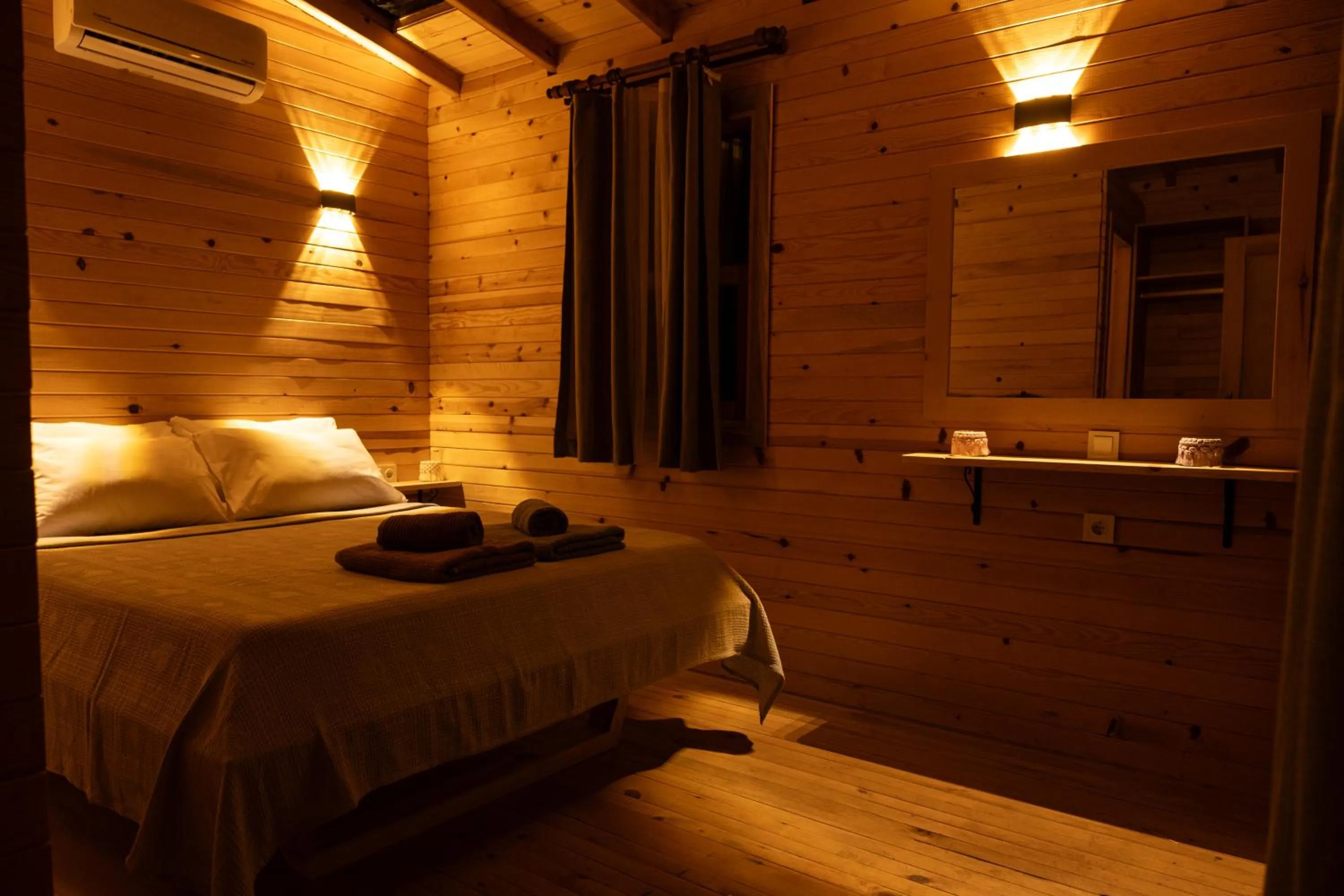 Bed in Goat Bungalow and Camping