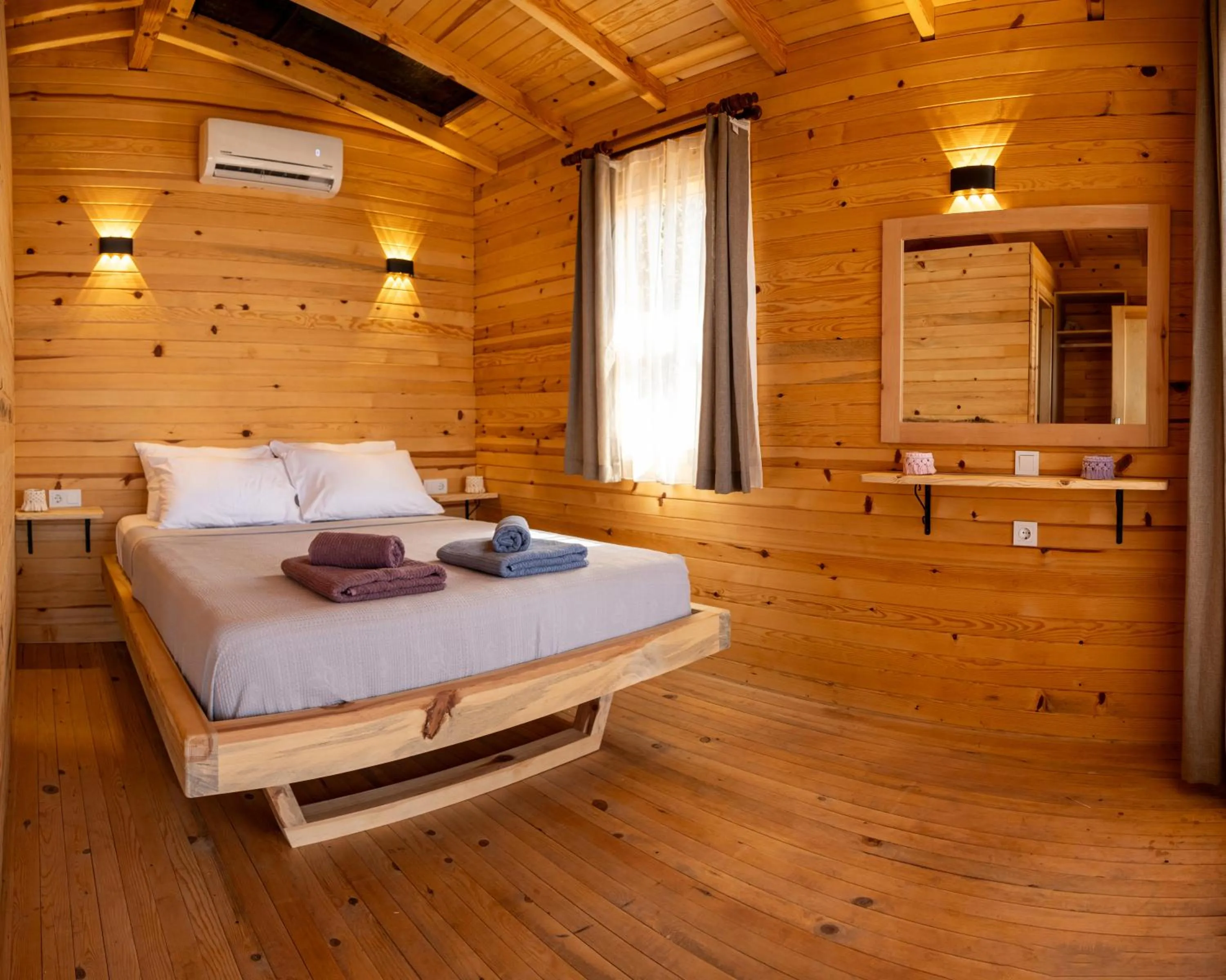 Bed in Goat Bungalow and Camping