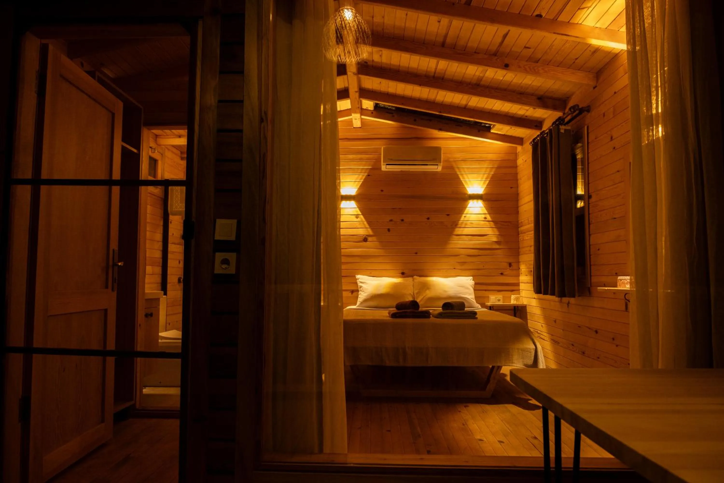 Bed in Goat Bungalow and Camping