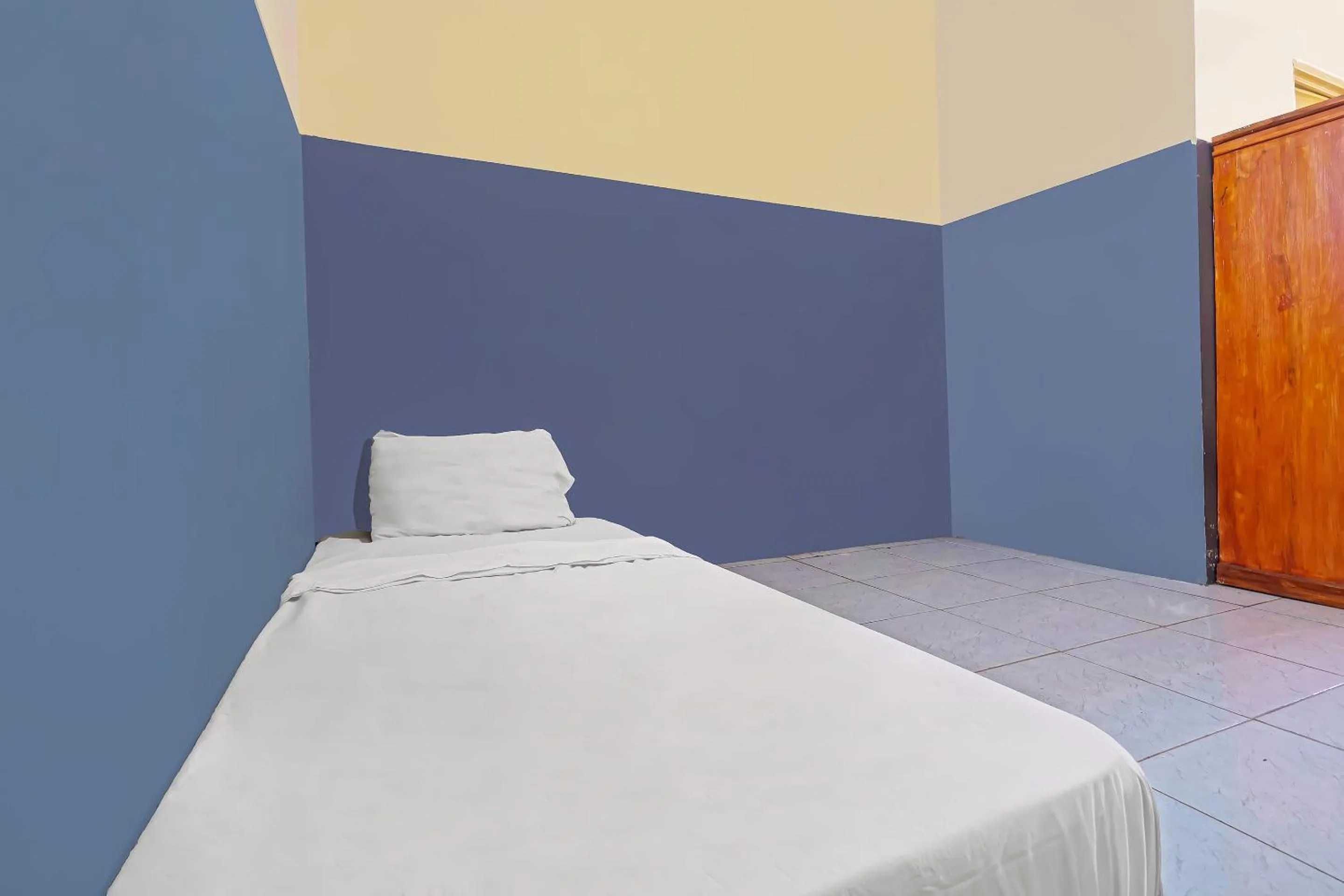 Bedroom in Hotel O Santana Residence Syariah