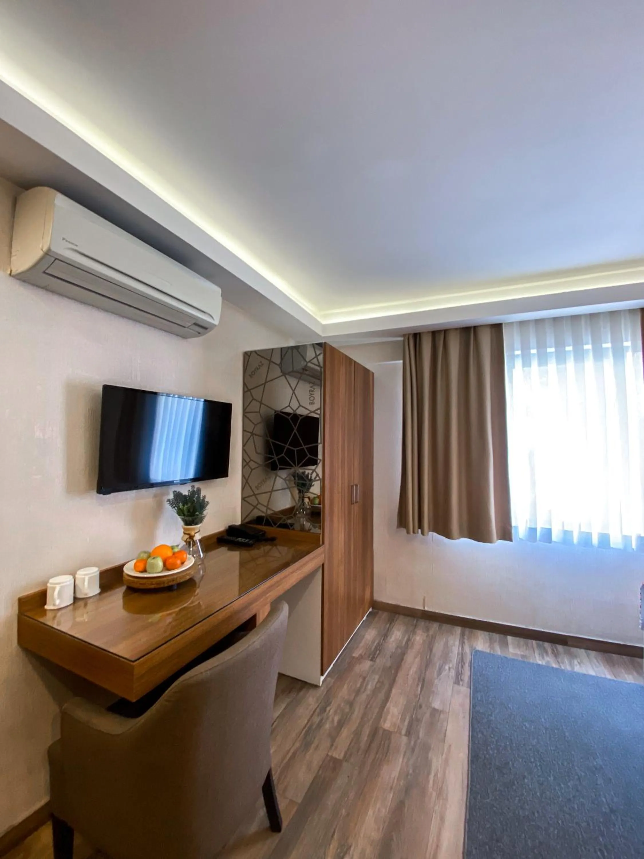 Communal lounge/ TV room, Bed in BGuest Hotel & Residence