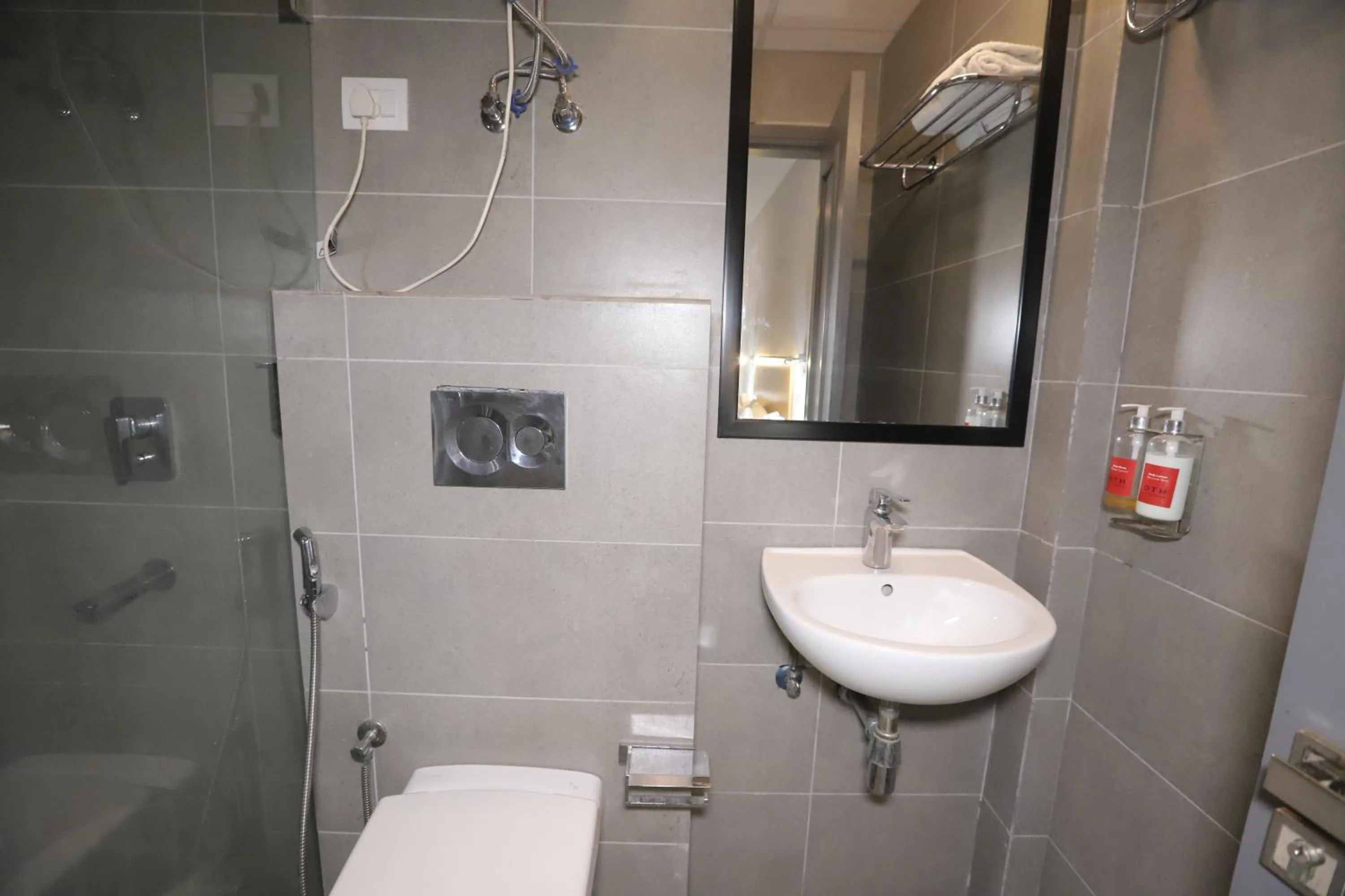 Shower in Qotel Comfort IP Residency East Delhi Preet Vihar
