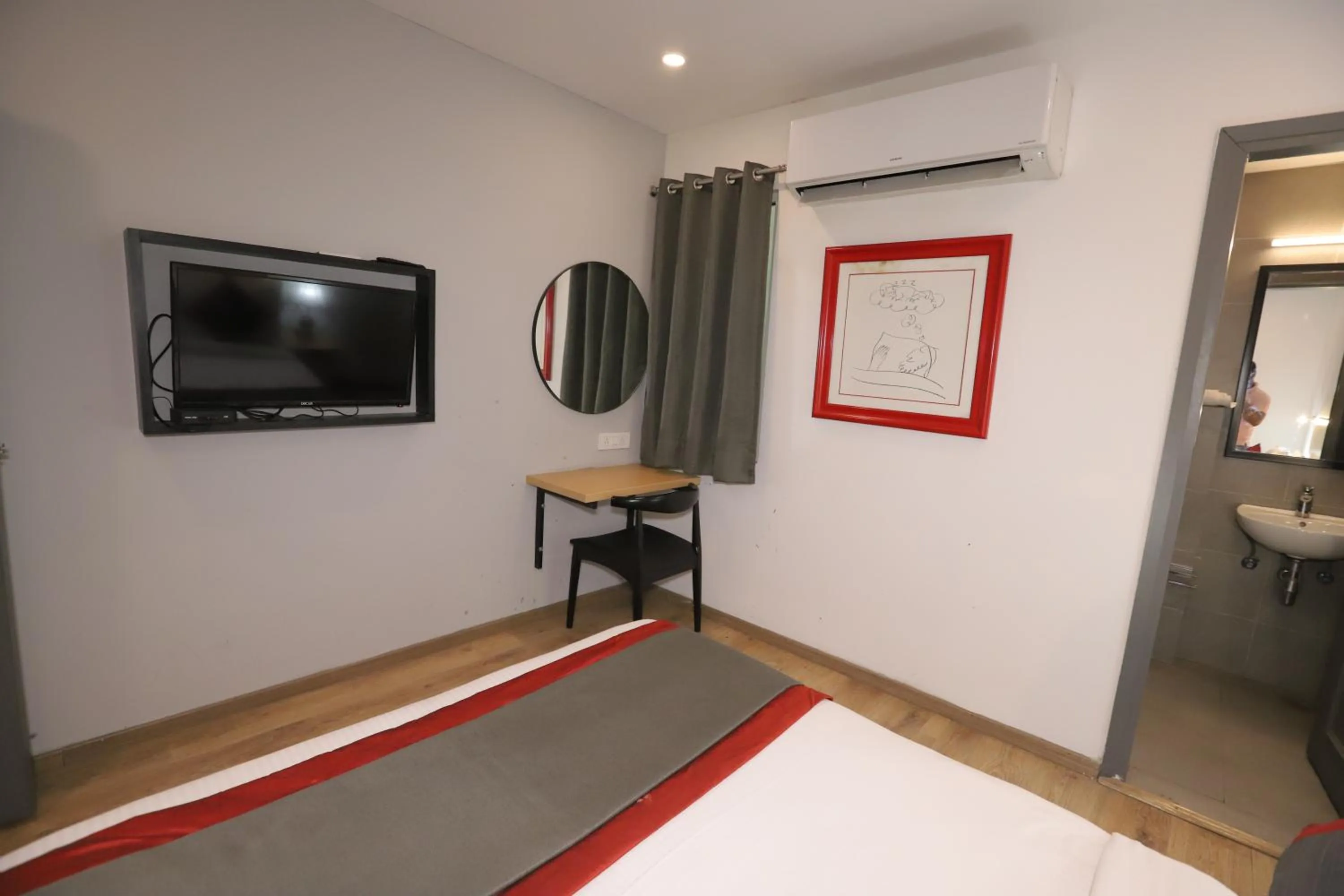 Communal lounge/ TV room, Bed in Qotel Comfort IP Residency East Delhi Preet Vihar