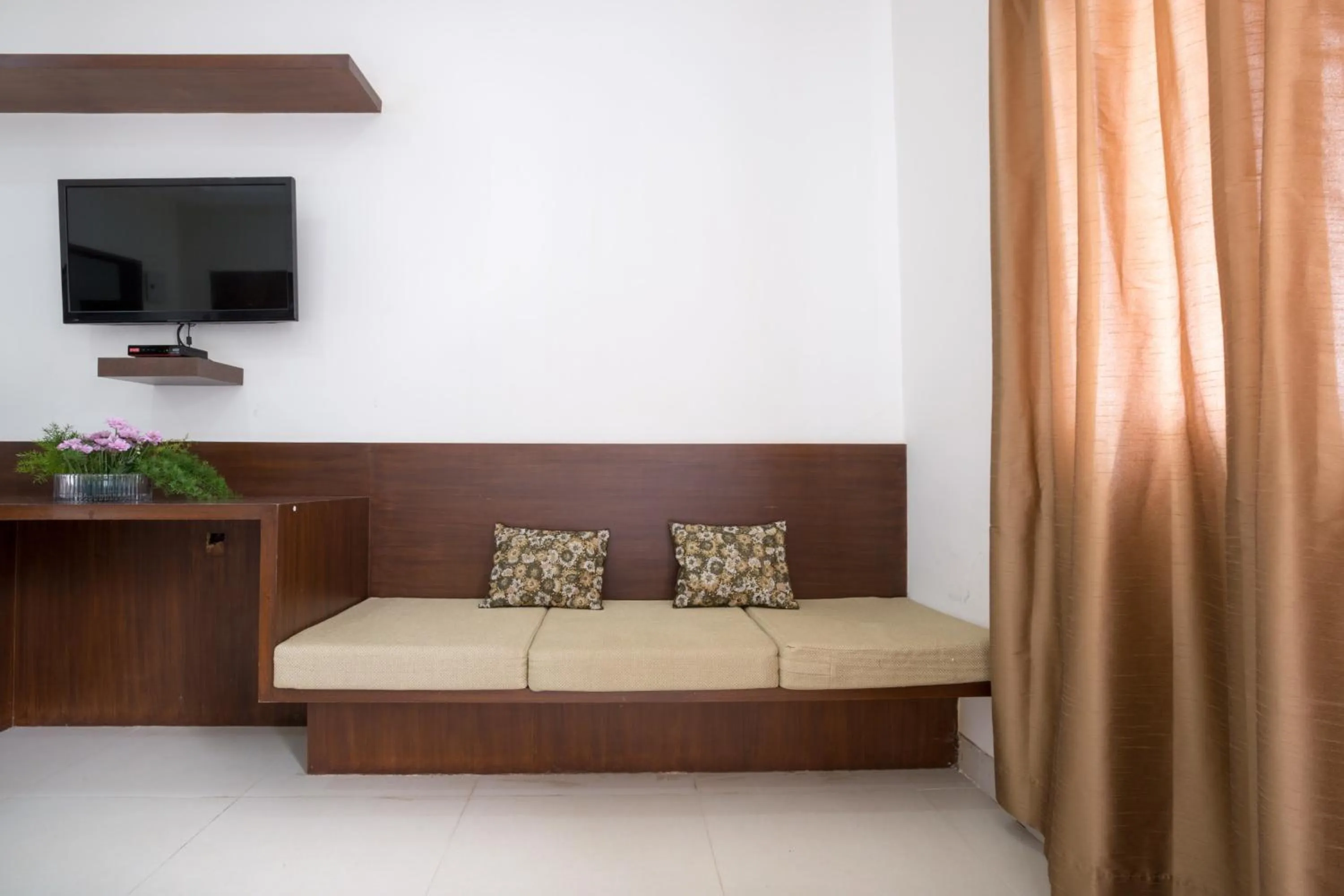 Seating area, Bed in Sanctum Suites BEL Road Bangalore