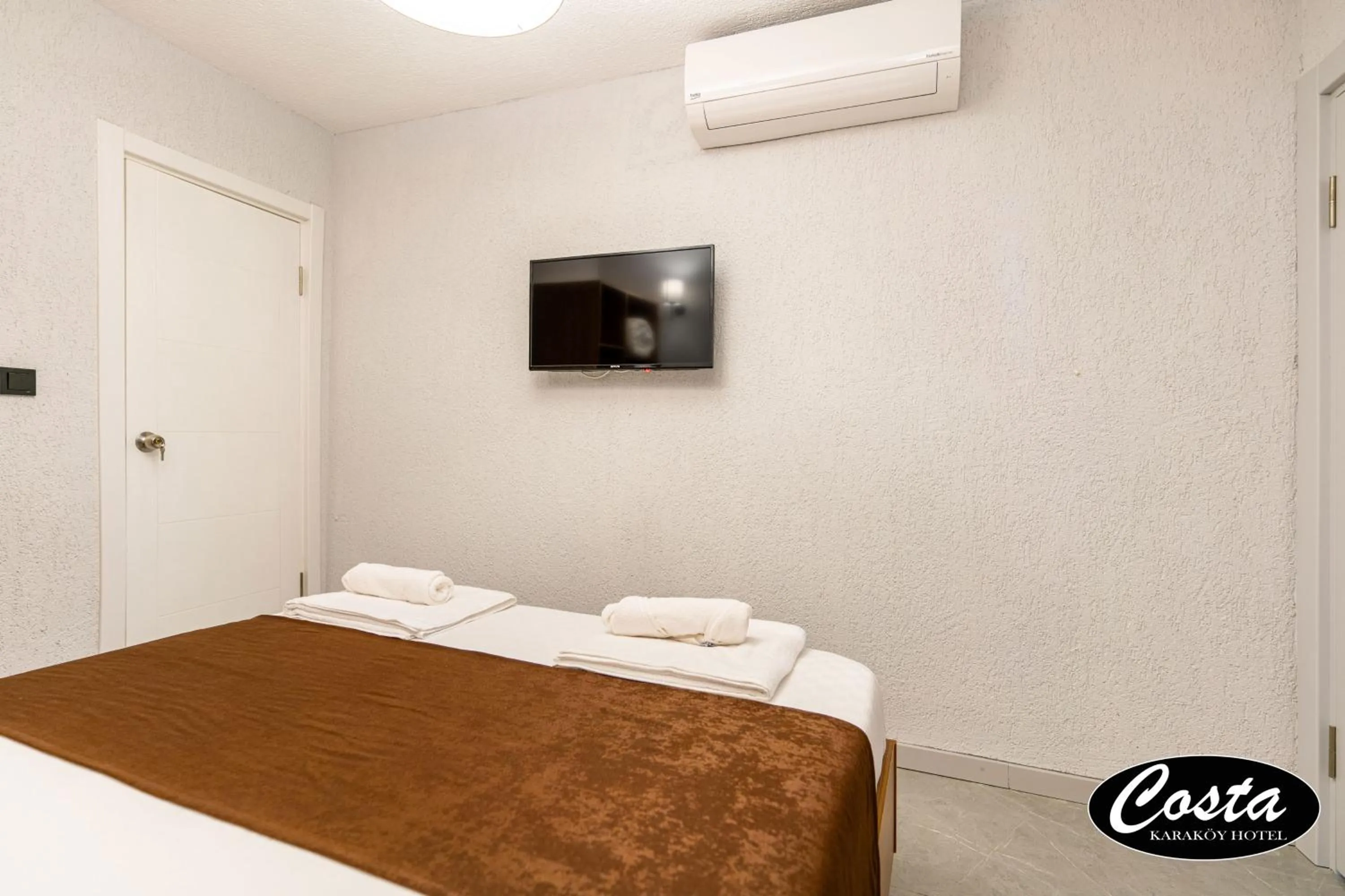 Bed in Costa Karakoy Hotel
