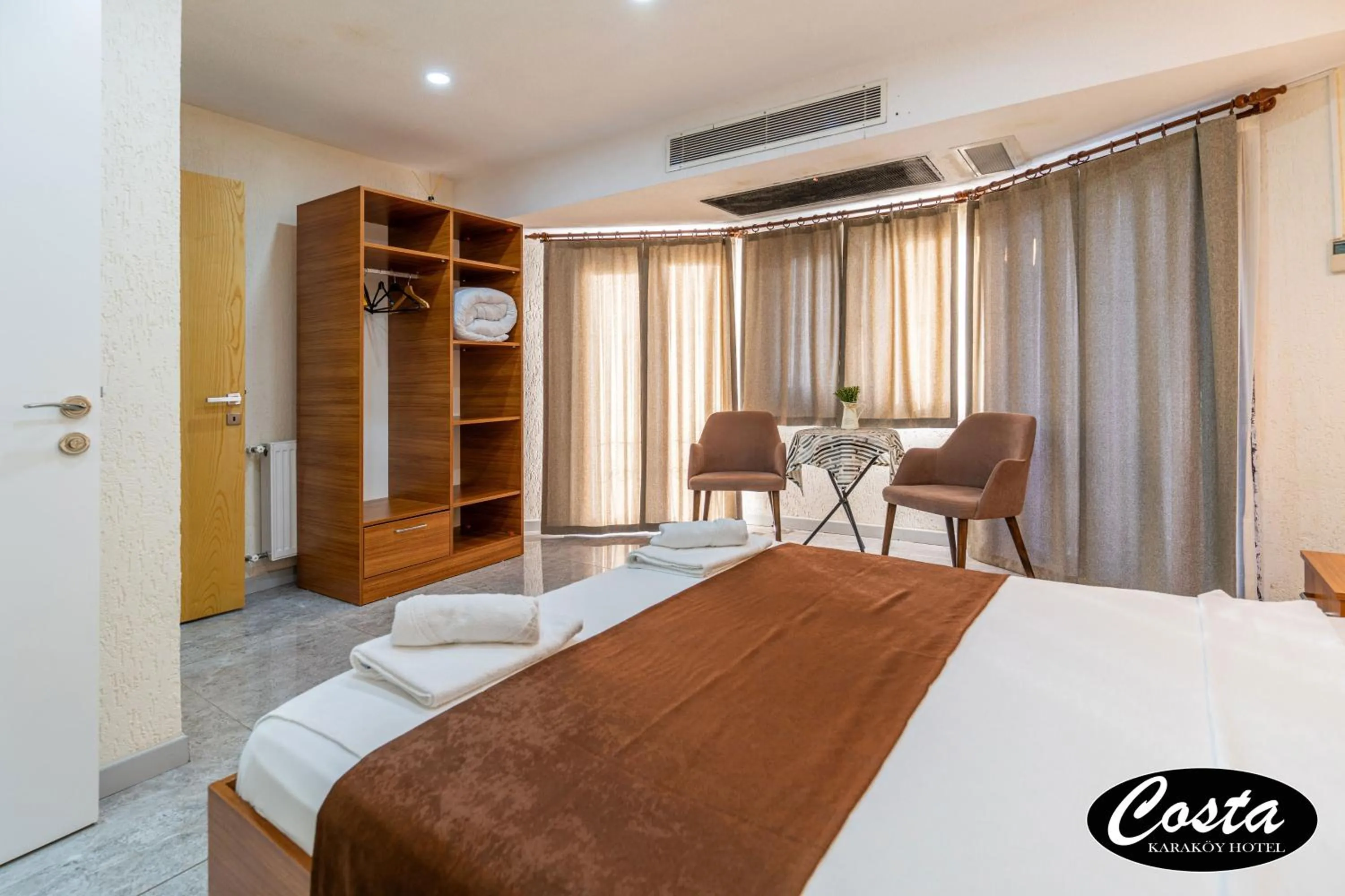 Bed in Costa Karakoy Hotel