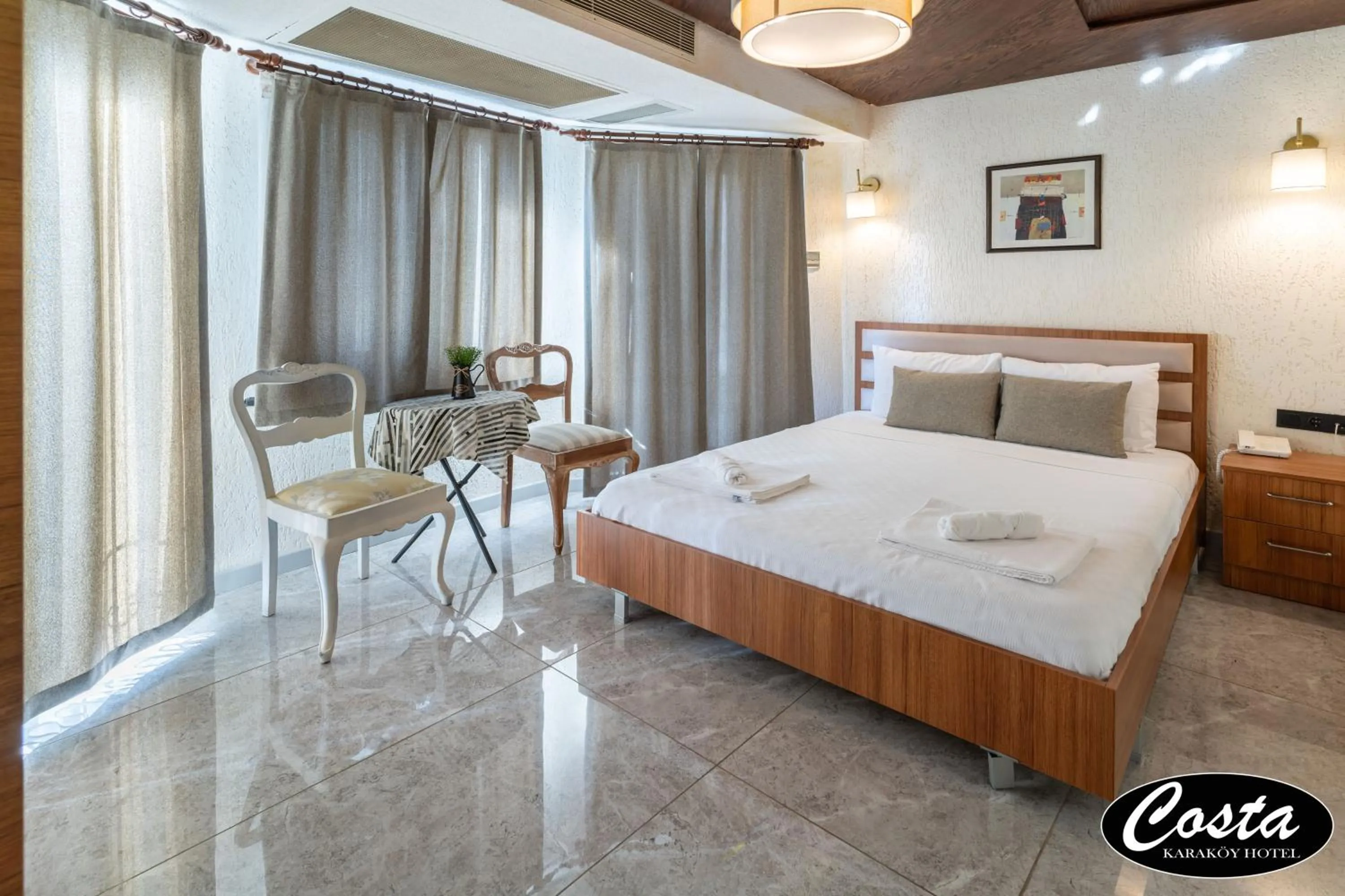 Bed in Costa Karakoy Hotel