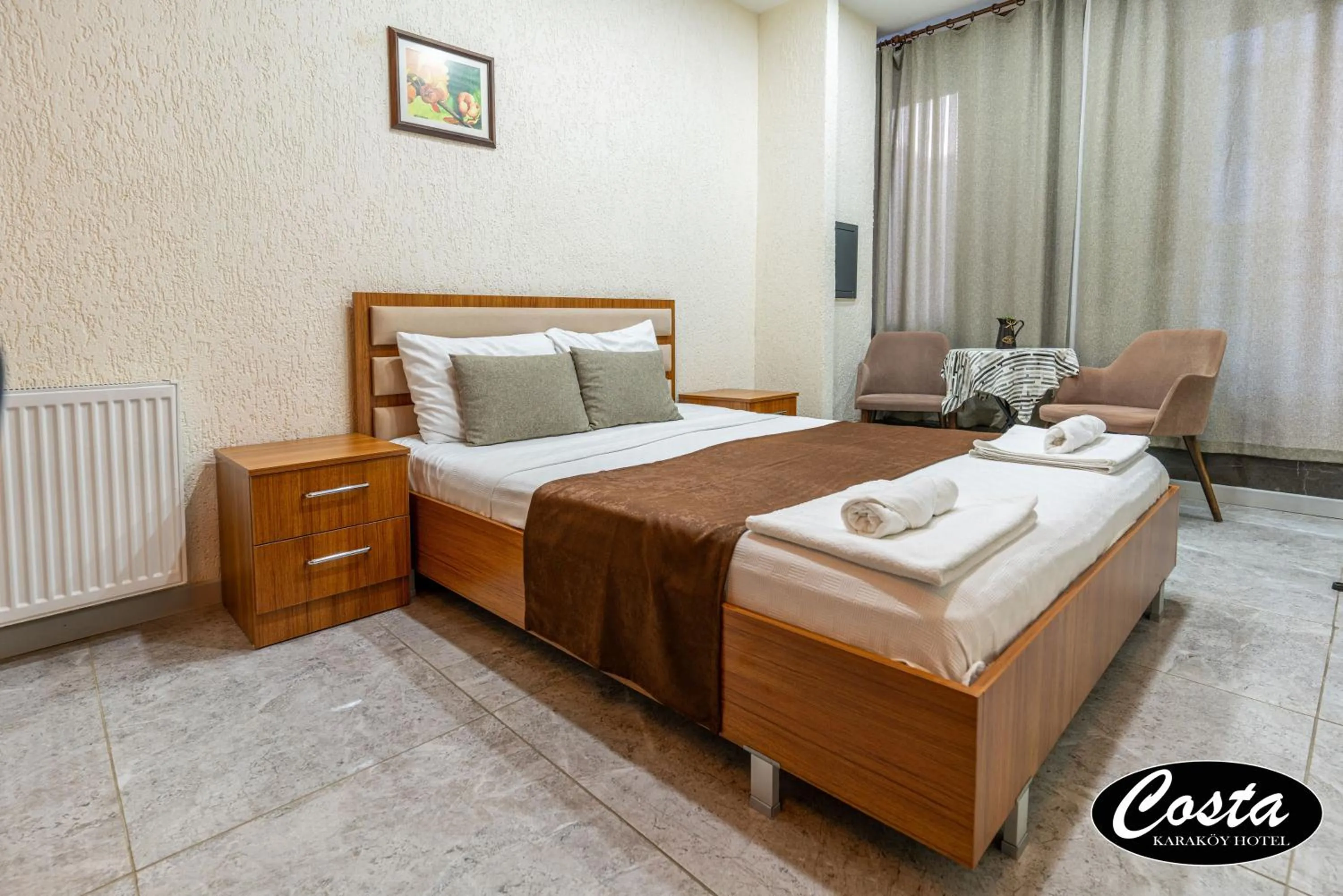 Bed in Costa Karakoy Hotel