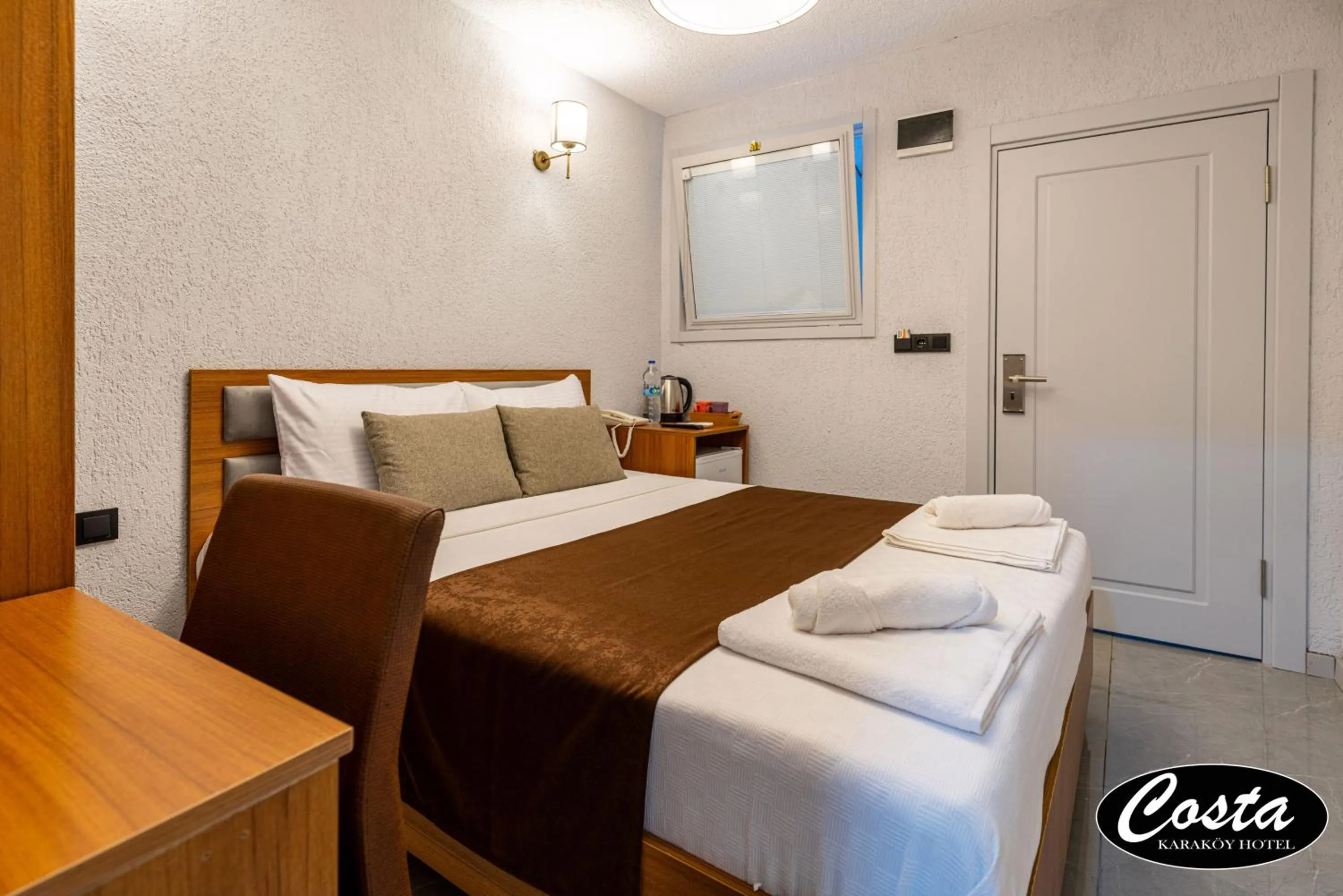 Bed in Costa Karakoy Hotel