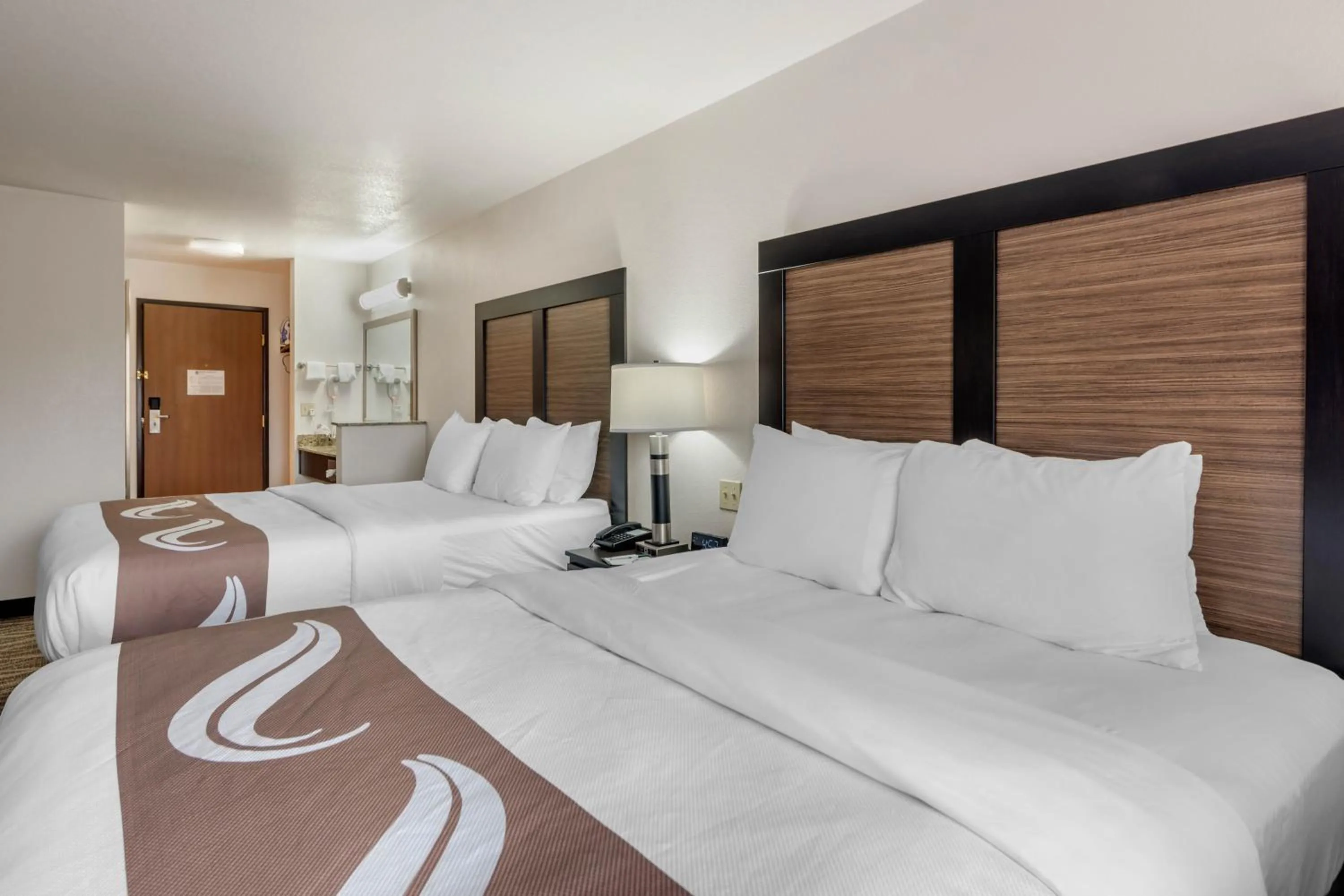 Bed in Quality Inn & Suites