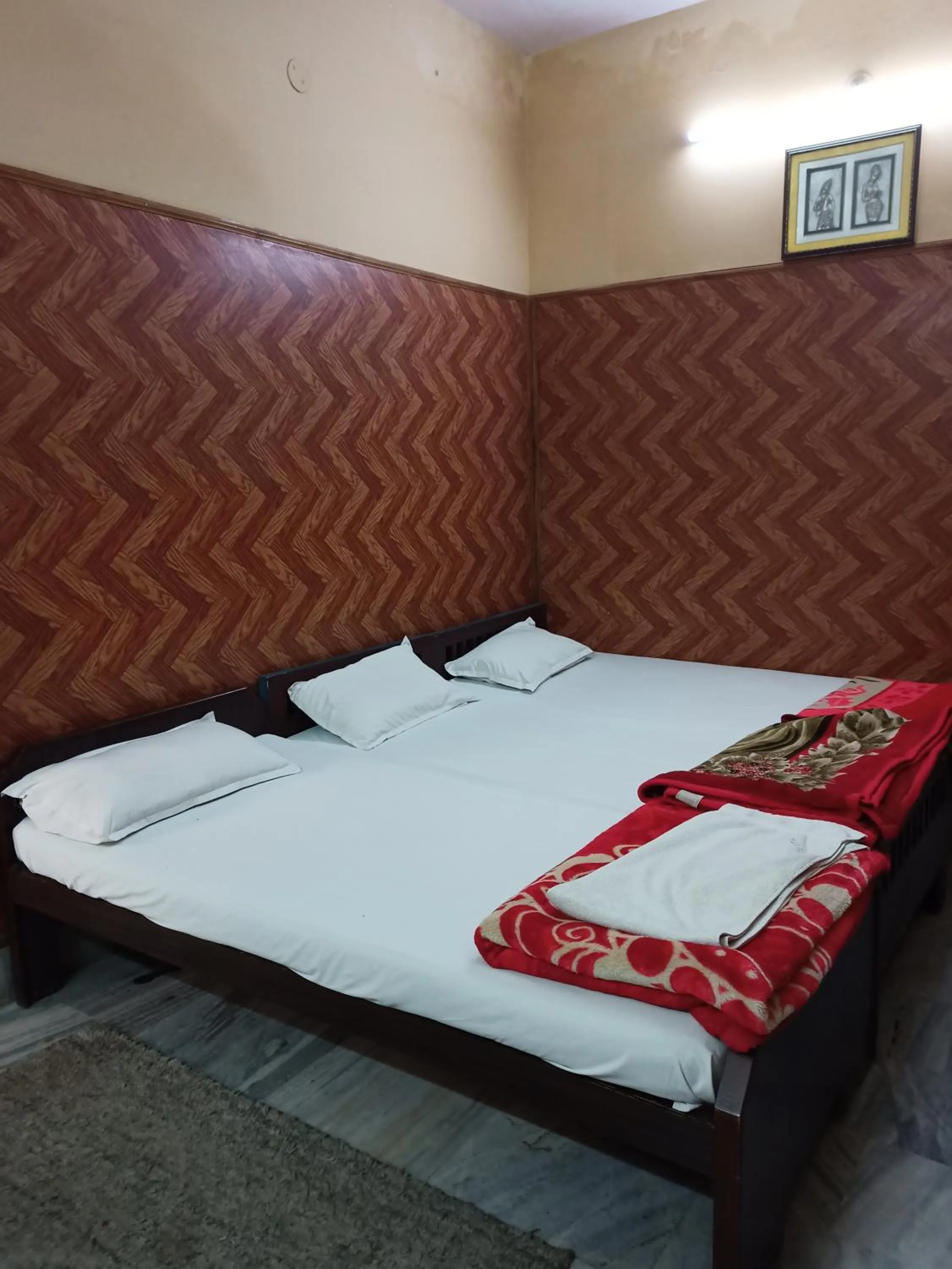Bedroom in Teerth Guest House