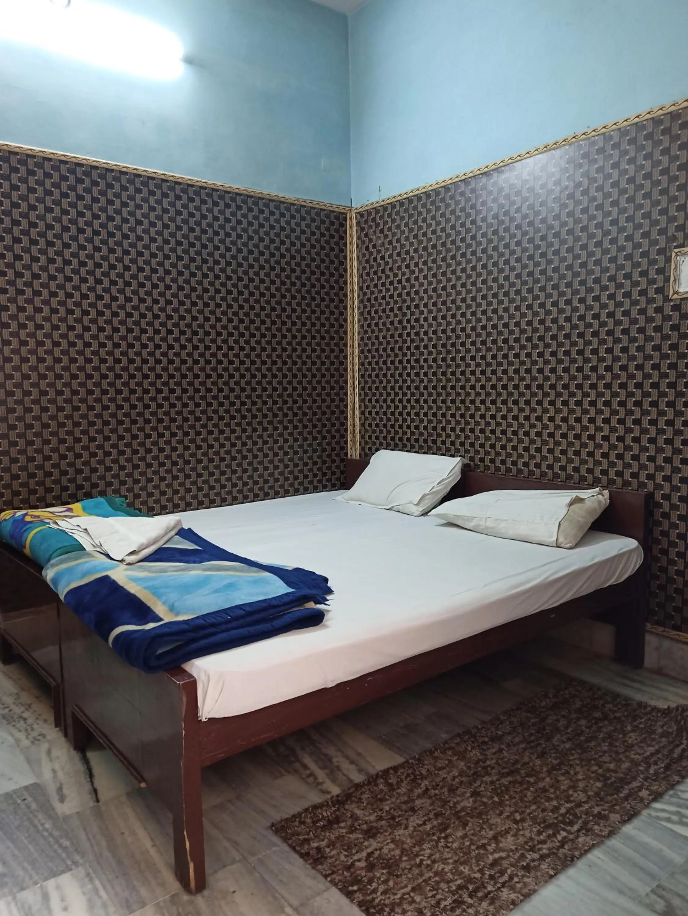 Bedroom in Teerth Guest House