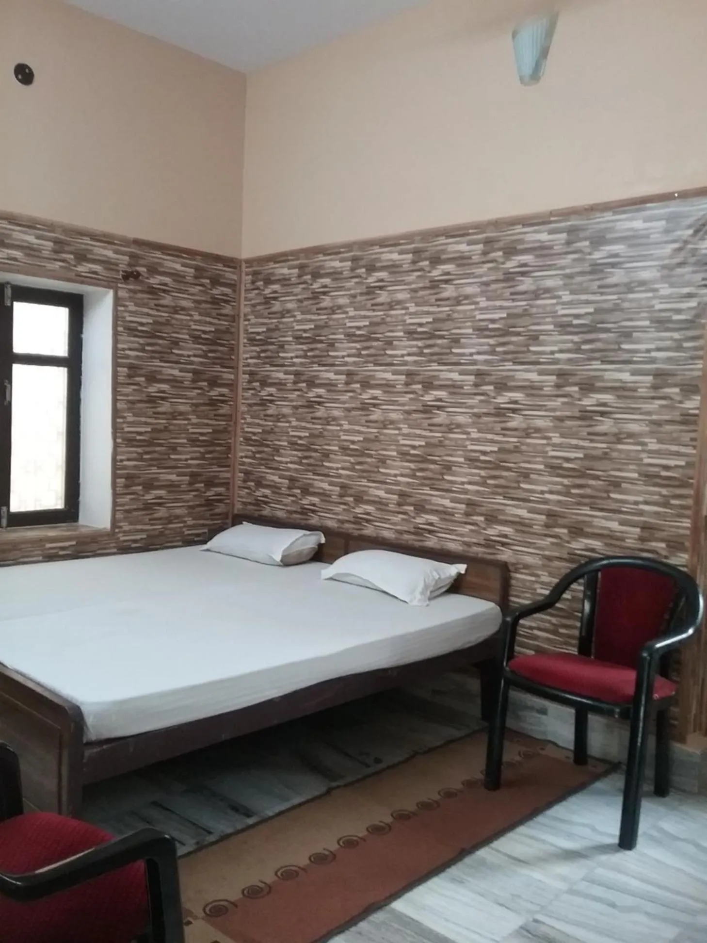 Bedroom in Teerth Guest House