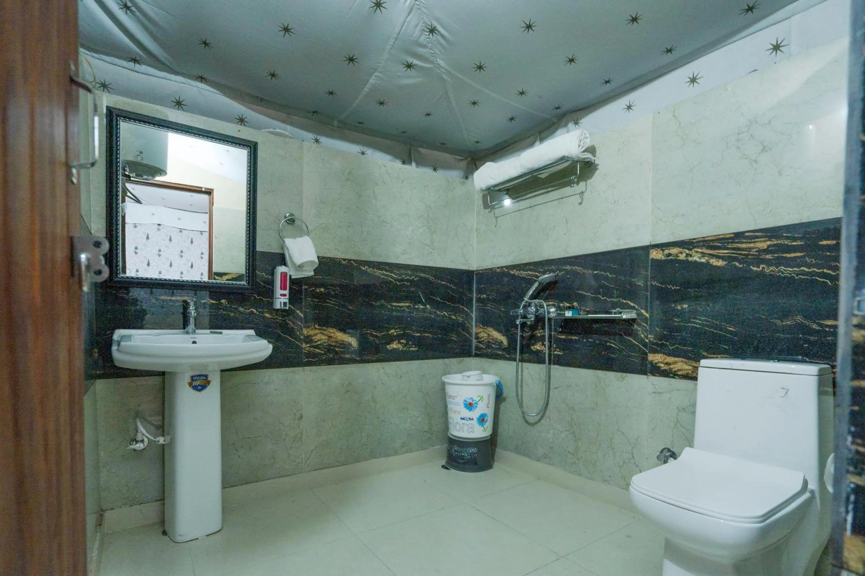 Shower in MST Cricket Village By Four Leaf Hotels