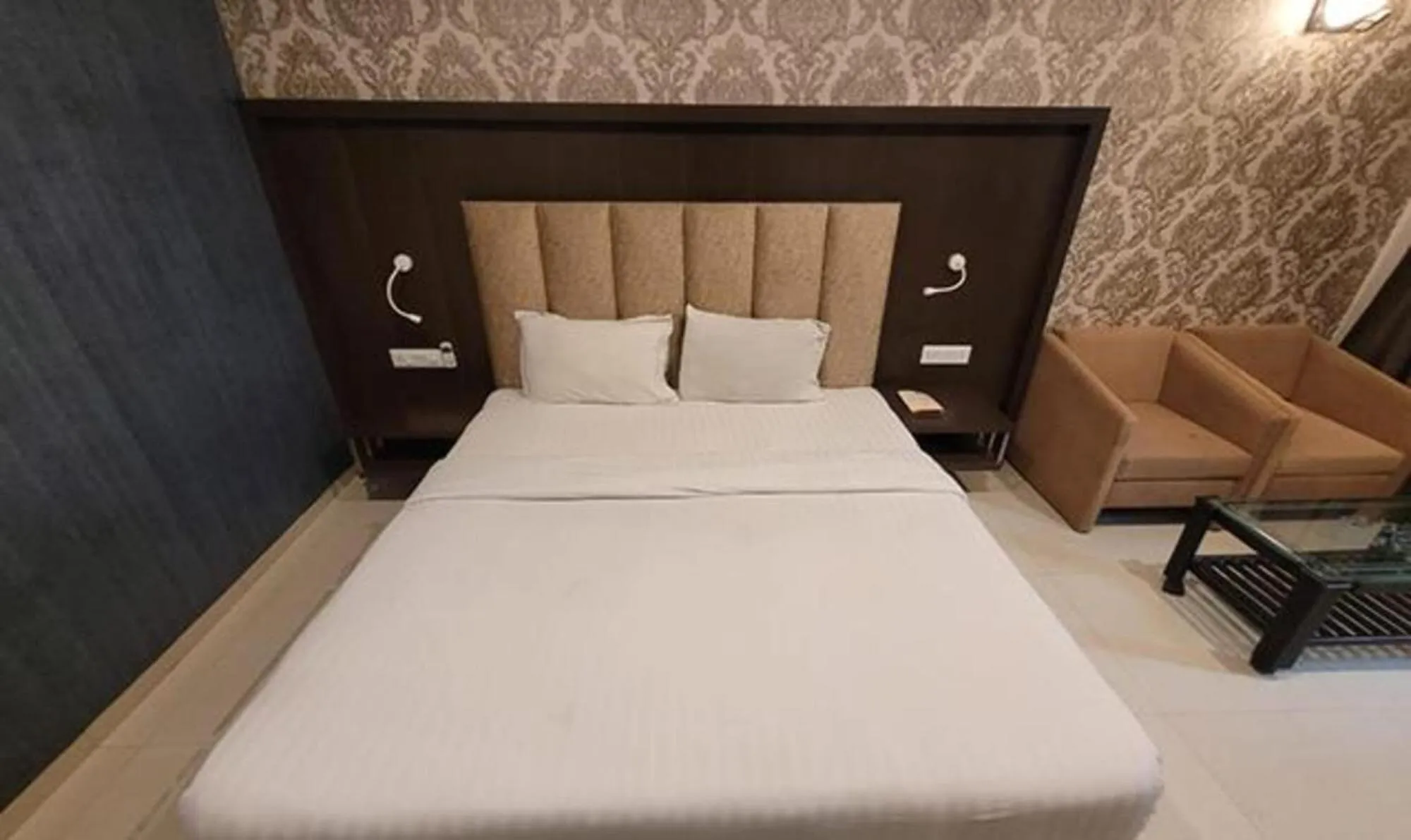 Bed in FabHotel Prime Sapphire Regency